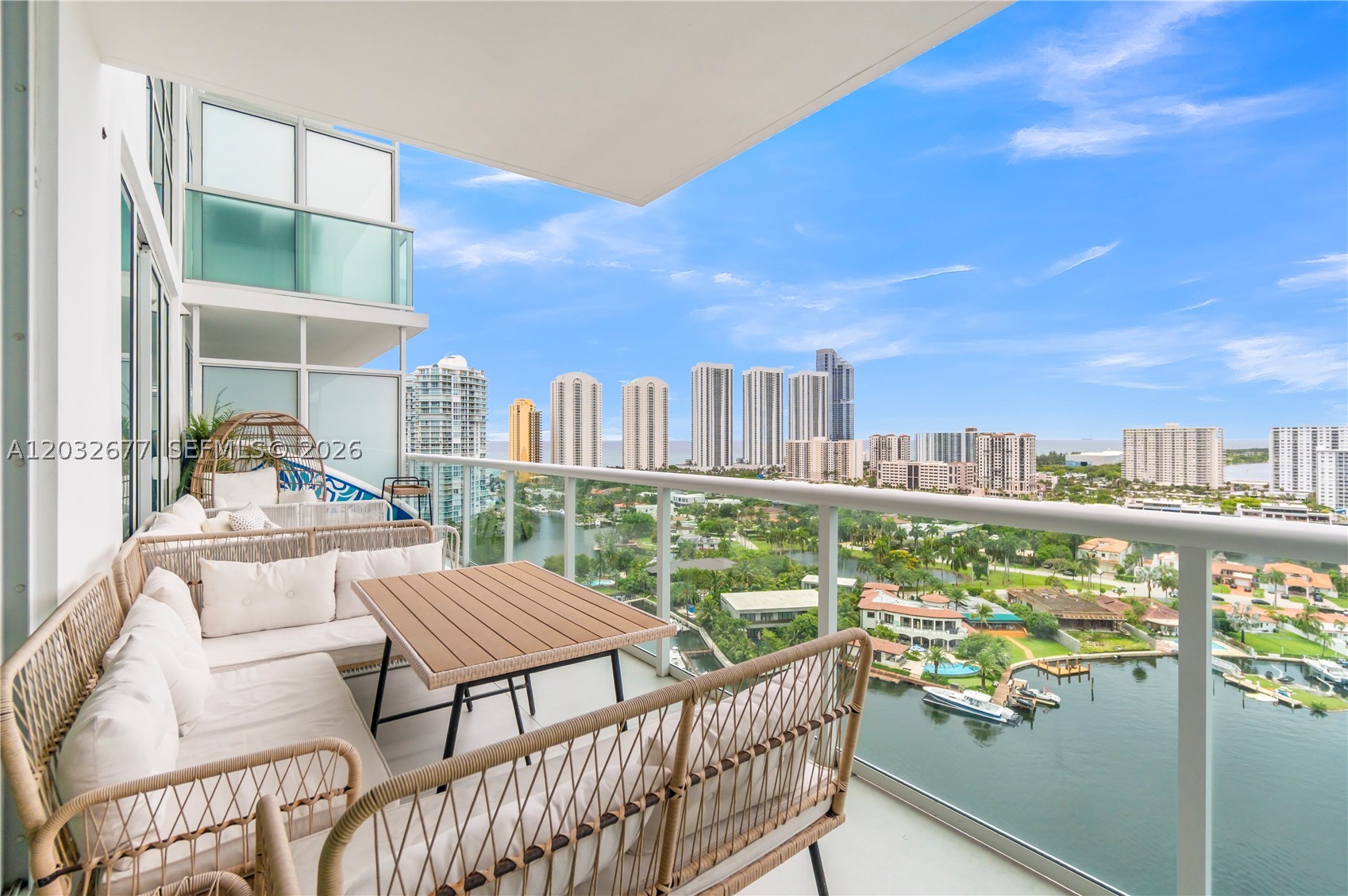 Elevated waterfront living awaits in this 19th-floor residence at 400 Sunny Isles. Featuring 2 bedrooms, 3 full bathrooms, plus a den/office, this modern condominium offers floor-to-ceiling impact glass, open water views, and a thoughtfully designed split-bedroom floor plan. The chef-inspired kitchen features Italian cabinetry, premium appliances, and generous storage, while custom built-ins and walk-in closets enhance functionality throughout. Enjoy a spacious balcony overlooking the Intracoastal and skyline. Residents enjoy marina access, resort-style amenities, valet, concierge, fitness center, pool, spa, and tennis. Ideally located near the beach, Aventura Mall, Bal Harbour Shops, parks, and dining.