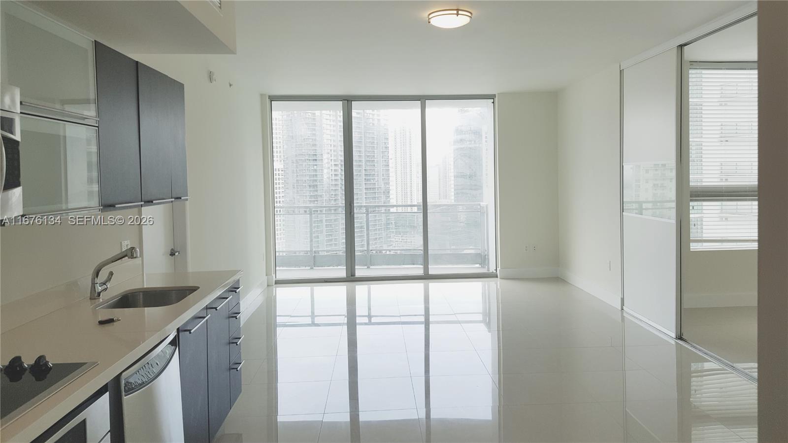 Live in Miami's premier gated in Downtown. This 2 Bedroom, 2 Bathroom boasts breathtaking views of the Brickell Skyline, Miami River, and the ocean. Featuring stainless steel
appliances, an in-unit washer and dryer, new flooring, and a practical split floor plan, this condo ensures both style and comfort. The unit includes one assigned parking space as
well, basic cable, water, and WI-FI, residents enjoy a state-of-the-art fitness center, clubhouse, pool deck, and a luxurious spa, complete with sauna, steam room and massage
rooms. Additional amenities include a dog park, children's playground, an on-site bistro, mini market and dry cleaner. Conveniently located within walking distance of top-tier
restaurants, shopping, and entertainment in Brickell and Downtown.