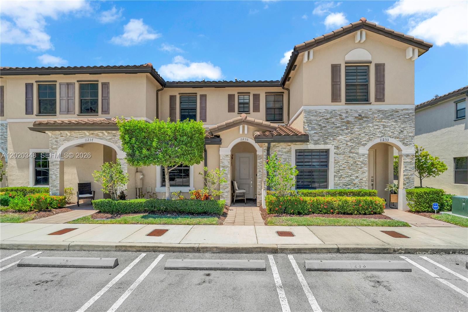Beautiful 3-bedroom townhome/villa in the highly desirable Isola community. This modern home features a convenient first-floor bedroom and full bathroom, perfect for guests or multi-generational living. The open-concept layout flows seamlessly into a spacious covered patio, ideal for relaxing or entertaining.  This gated community offers a state-of-the-art clubhouse with a fitness center, recreation area, sparkling pool, and children’s playground. Conveniently located just minutes from Florida’s Turnpike, Isola combines comfort, style, and accessibility.