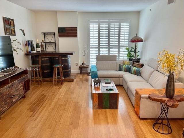 Beautifully appointed and impeccable furnished unit. Renovated with the highest standards to detail. Plantation shutters, beautiful granite counter tops and gorgeous bamboo wood flooring throughout. Live, work and play in this urban community that offers great restaurants and other retail stores. The unit also has a private patio and is located on the courtyard level. Close to major highways, mall and metro rail. Second parking space available in the residential level for an additional fee. NO PETS PLEASE.