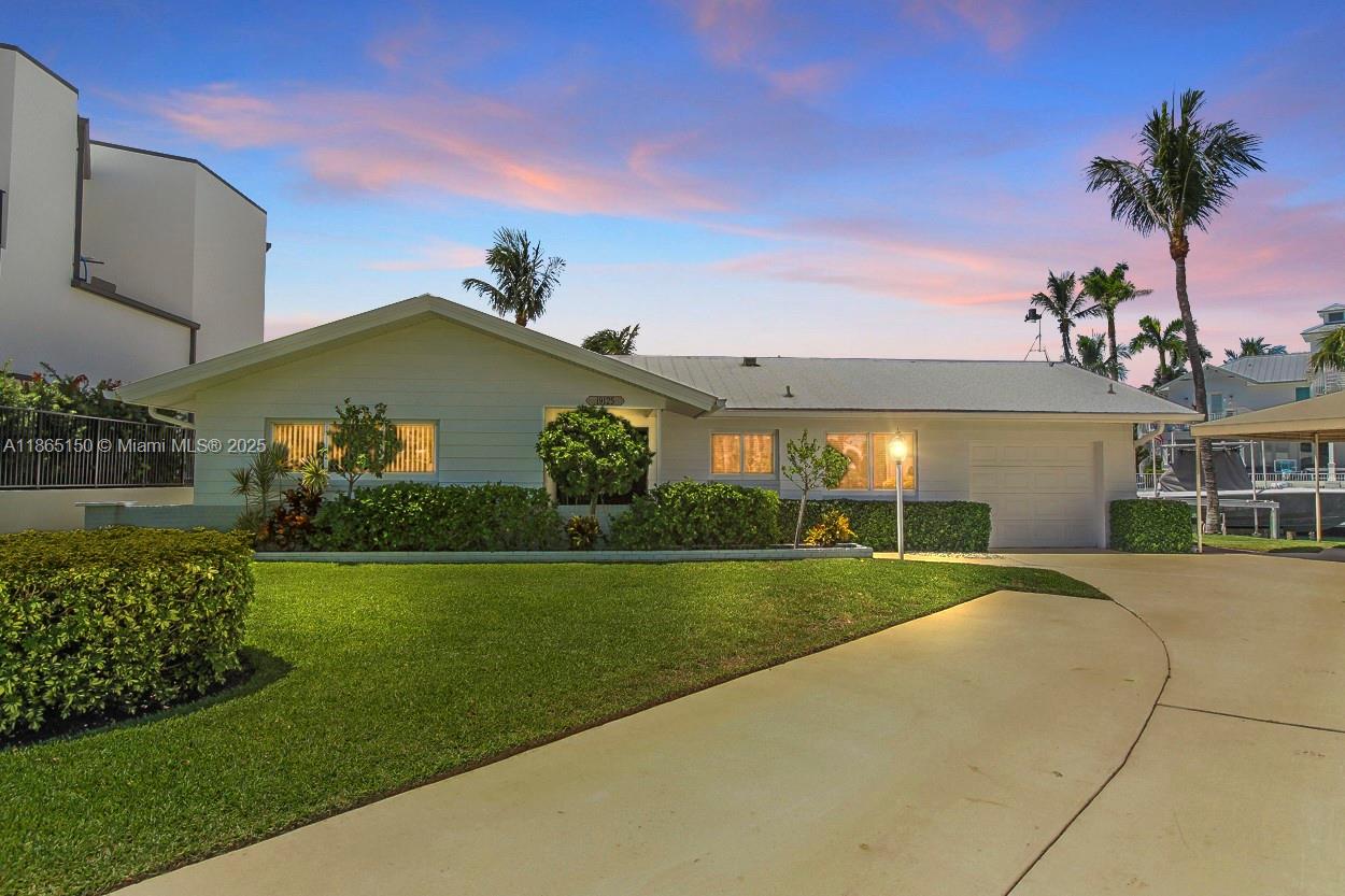 Rare Opportunity for this prime waterfront location minutes to the Jupiter Inlet with no fixed bridges! Situated on .35 acre corner lot with 123 ft plus of seawall this 3 bedroom / 2 bath pool home has endless possibilities.  Dock includes one 50 ft dock with composite decking 60 amp pedestal and a 15 ft dock with a 16k boat lift- all new electric dock wiring in 2025.  Updated Kitchen with granite countertops and stainless steel appliances , Hurricane Impact windows and doors.  Pool resurfaced in 2025 with new equipment & heater, New AC in 2026.  Truly a one of a kind oppurtinuty to own on the Jupiter Waterway !