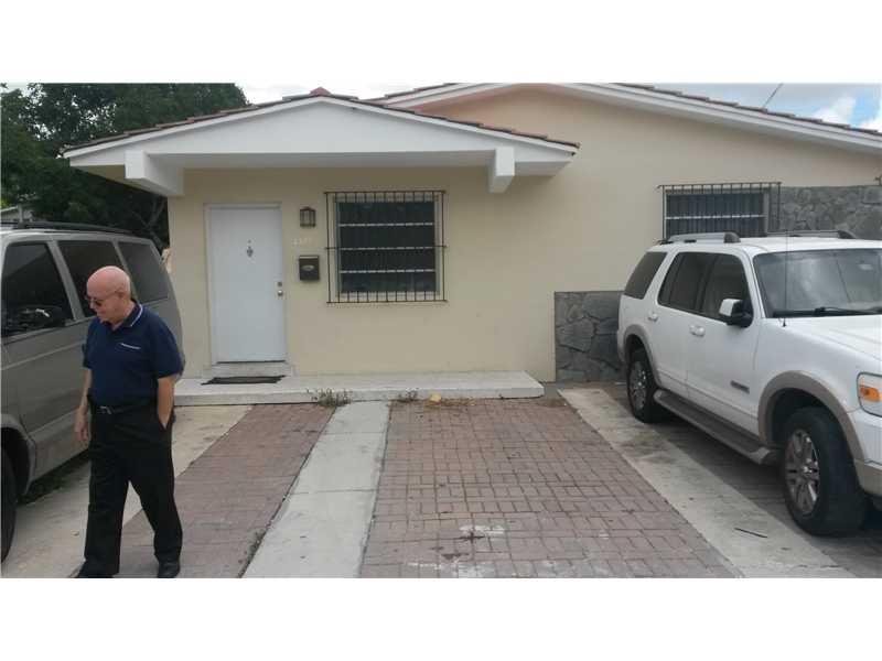 HALF A BLOCK AWAY FROM MIAMI SENIOR HIGH. MINUTES FROM DOWNTOWN MIAMI AND CORAL GABLES.COMPLETLY FENCED. HUGE ALUMMINUM PORCH WITH CEMENT FLOOR.3 PARKING SPACES INSIDE PROPERTY.
