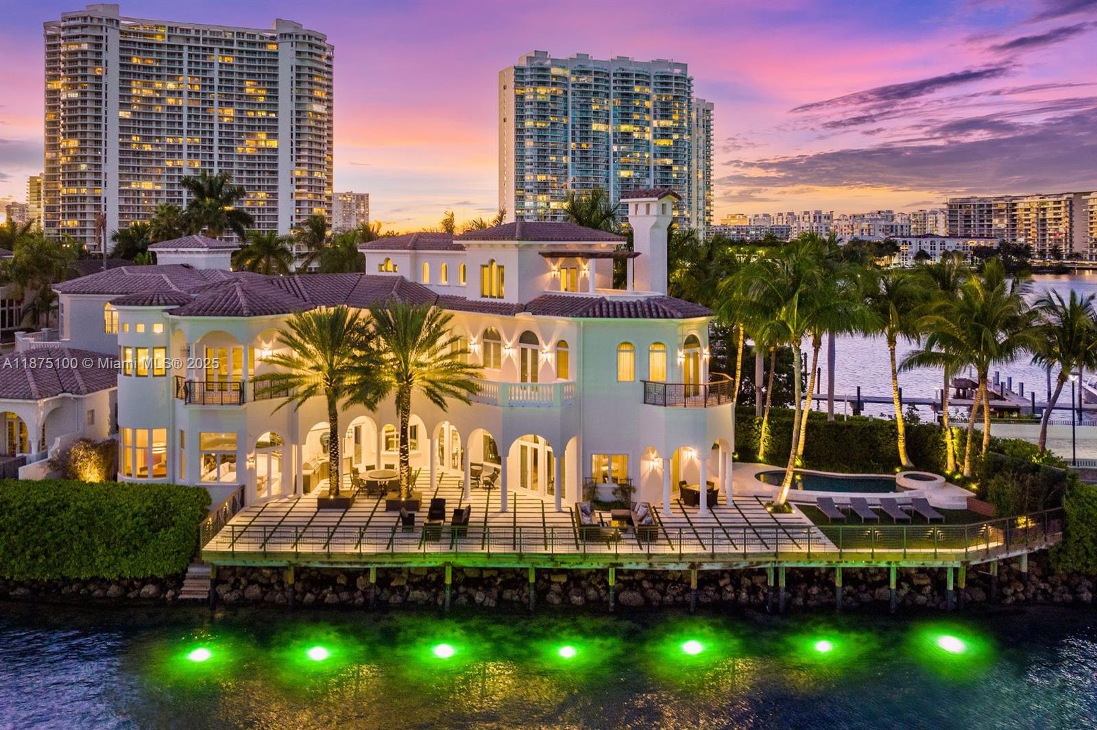 Sophisticated Island Living! Welcome to your own private waterfront paradise, a tri-level architectural estate offering 5 bedrooms, 6 full baths, and 2 half baths. Positioned along 251 feet of wide bay frontage, this residence captures sweeping, unobstructed views at every turn. Interiors are finished in rich marble and walnut wood floors, with voluminous living spaces designed for both grand entertaining and intimate everyday moments. The expansive primary suite opens to a waterfront terrace, while every bedroom enjoys its own balcony framing the bay. Outdoor living is elevated with a resort-style pool and spa, summer kitchen, custom lounge areas, and tranquil seating vignettes. Designed with bespoke finishes and modern comforts, this estate delivers a lifestyle without compromise.