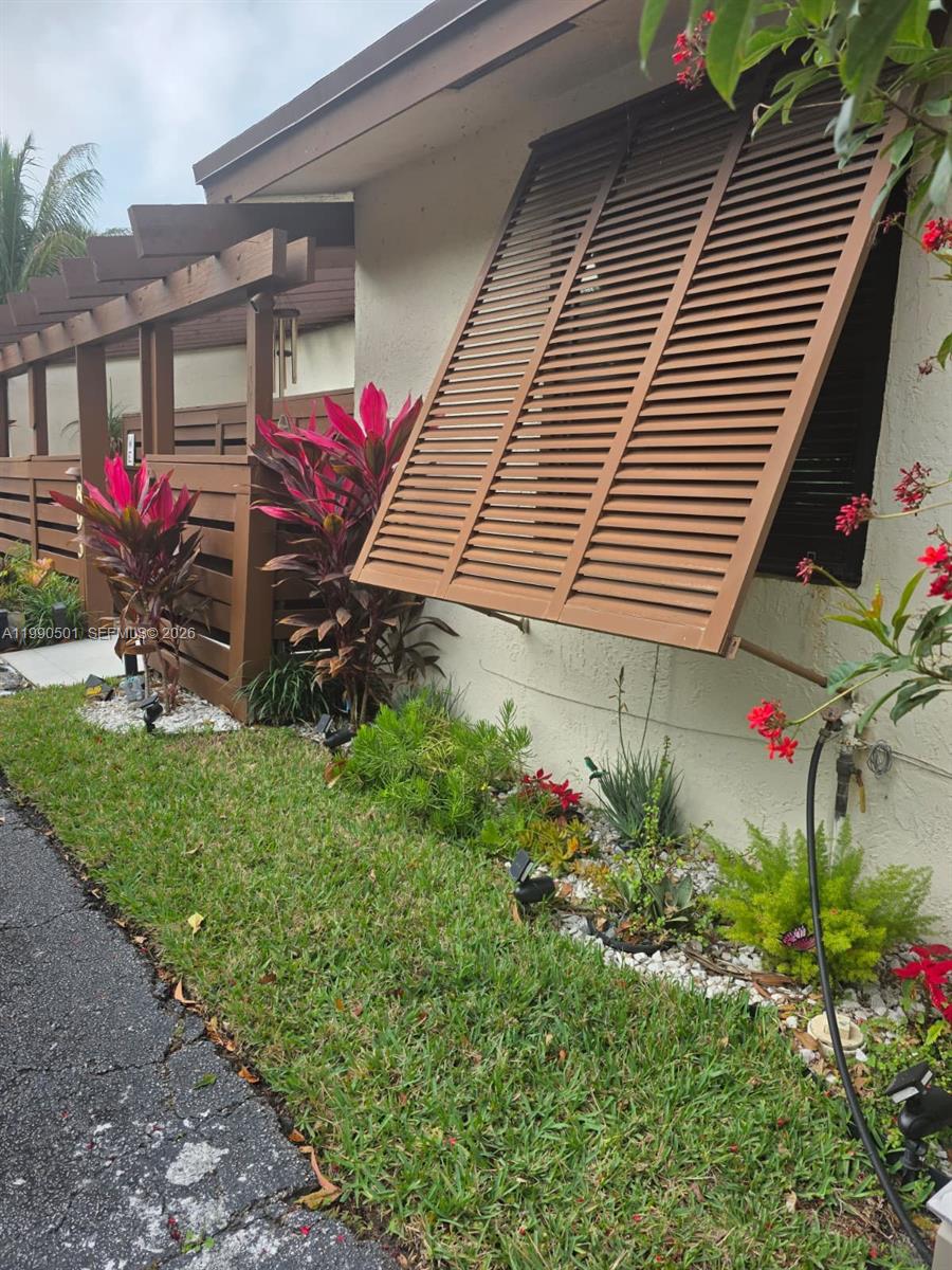 Well-maintained 3BR/2BA townhouse in Davie featuring tile flooring throughout, impact windows, newer A/C, and a recently replaced roof. A central atrium fills the home with natural light and provides a unique space for plants or a private retreat. The layout is functional and inviting, with a private patio and the opportunity for a new owner to update and personalize to their taste over time. HOA maintains the exterior and roof for maintenance. Residents enjoy access to community amenities including a pool, tennis and pickleball courts, and a quiet, setting. Conveniently located near parks, shopping, dining, Sawgrass Mills, and major roadways.