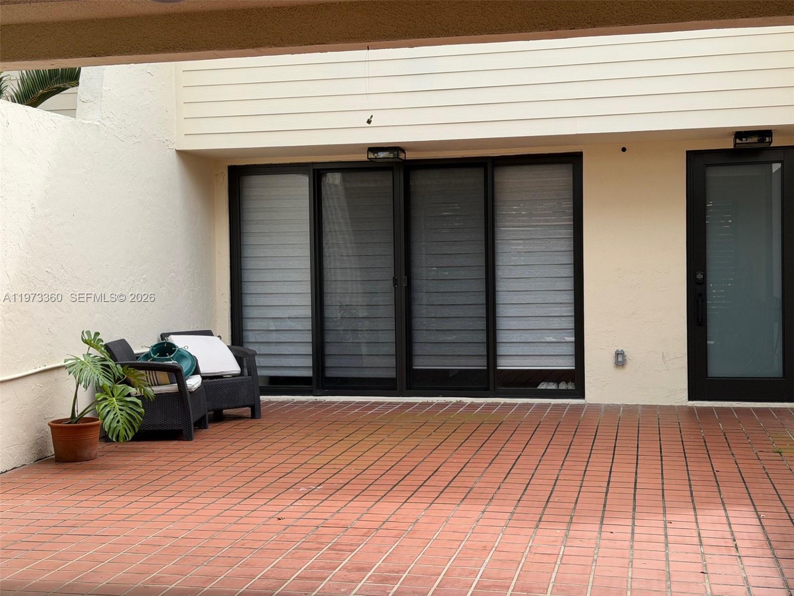 Best location in Kendall Town-Section One! Completely remodeled less than one year ago, including Roof, windows, doors, Kitchen, baths, etc. 2 Car parking in front leading to an additional secured covered 2 Car carport. Front tiled patio open air- 255 sq ft. New impact windows and doors throughout. Inviting fenced backyard opening to a large greenbelt with park benches all along a walking trail. New white Quartz kitchen & SS appliances, Large bedrooms, beautiful bathrooms & much more. This community offers resort-style amenities!  Rent a LIFE STYLE! Walking Trails, bike riding, Tennis, Pickleball, Racquetball, Resort-style Pool & hot tub, Gym, game rooms, and a Huge Clubhouse! No association approval! Easy walk to clubhouse, shopping and restaurants.