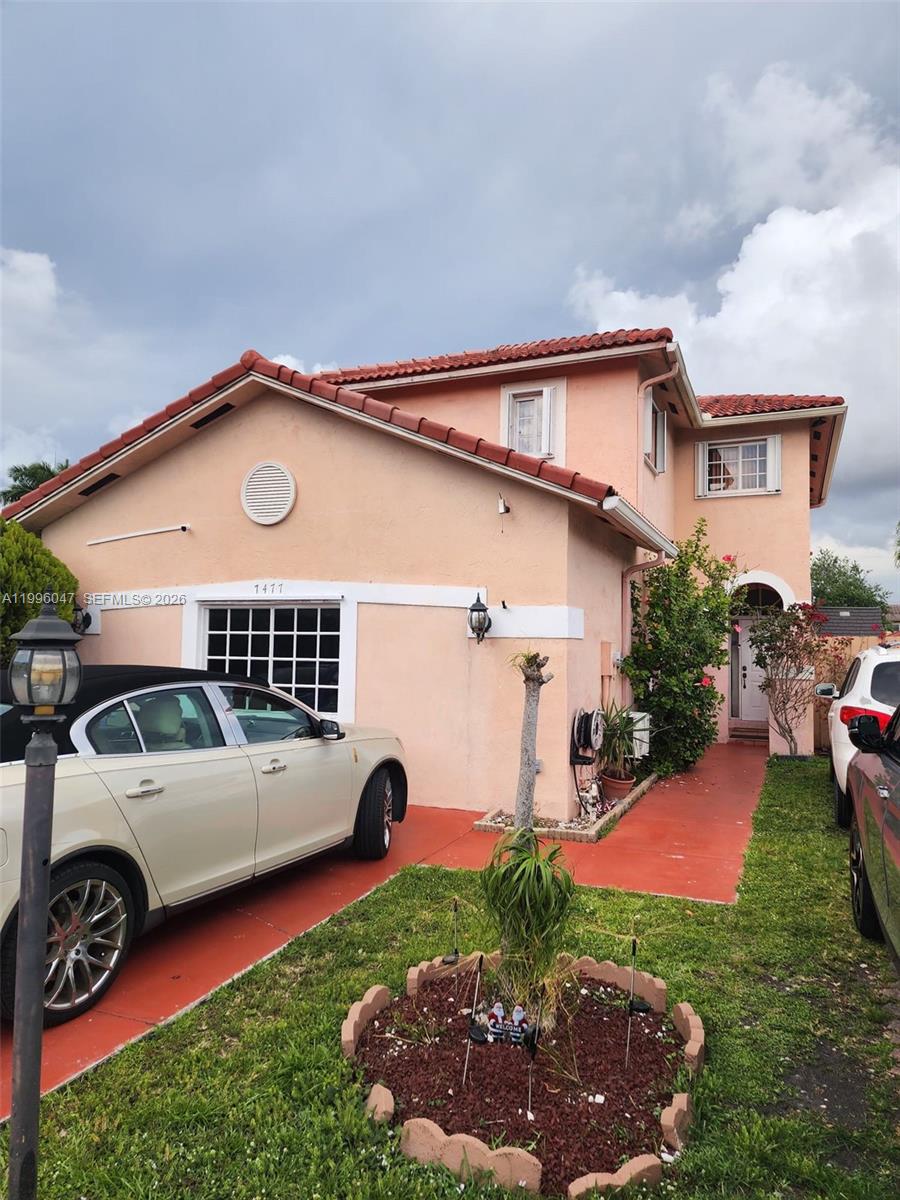 Beautifully home located in the gated community of Turtle Run in Non incorparated area next tyo Miami Lakes. This spacious residence offers 5 bedrooms and 3.5 bathrooms, including a garage converted into an additional living area (total 2,174 sq ft). The flexible layout allows the property to function as a 4-bedroom, 2.5 bath main residence, plus a separate 1-bedroom, 1-bath area with a kitchenette and private exterior entrance, offering privacy and independent. Price to sale