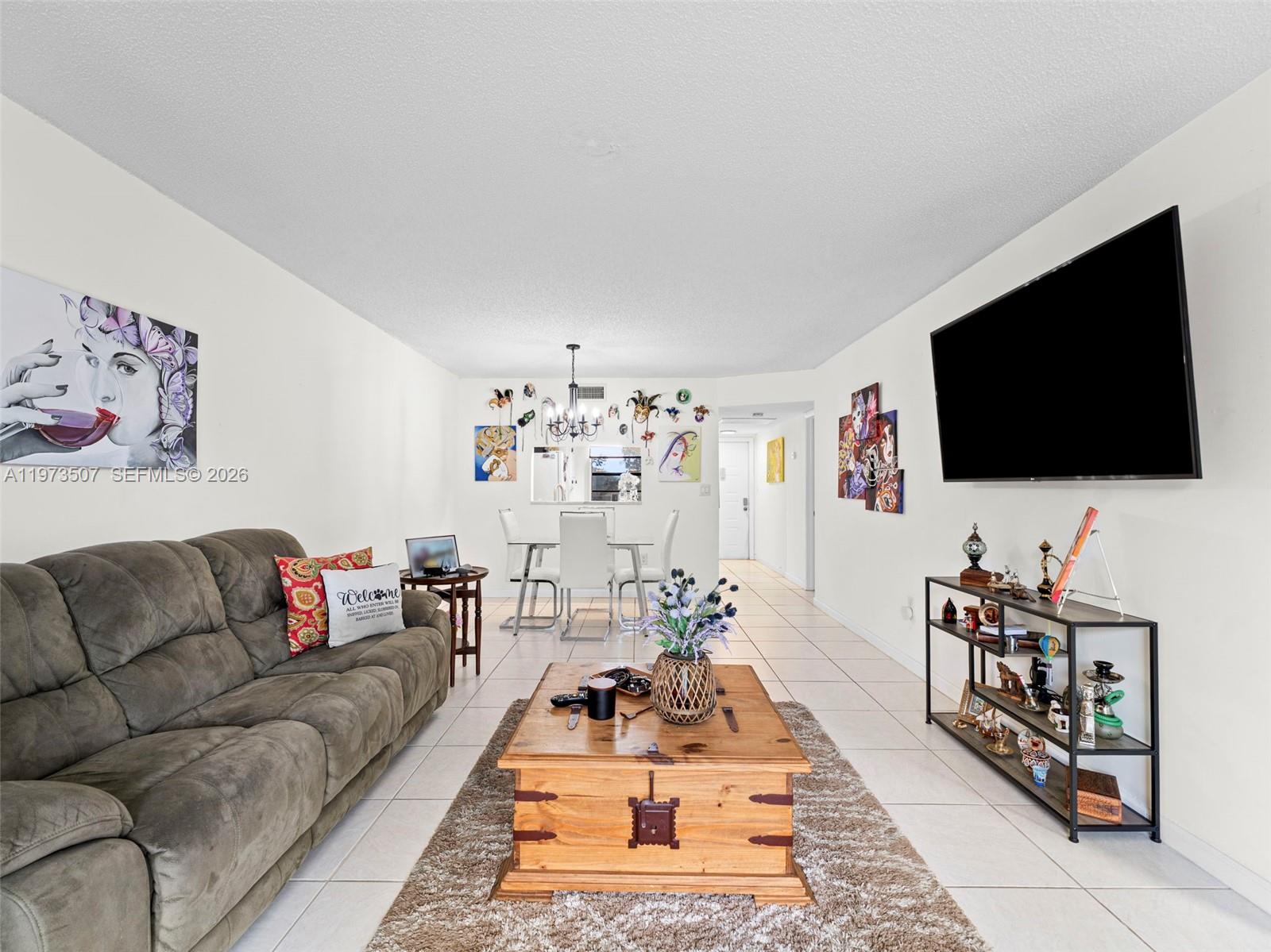 Experience the ultimate in resort-style 55+ living in this stunning 2-bedroom, 2-bathroom condo located in the highly sought-after Colony Point community of Pembroke Pines. This meticulously maintained third-floor residence offers a bright and spacious open-concept layout, highlighted by breathtaking panoramic lake views from your private, screened-in balcony—the perfect spot for morning coffee or sunset relaxation. The interior features a neutral color palette, a functional kitchen with ample cabinetry, and a large primary suite complete with a walk-in closet and ensuite bathroom. For your convenience and peace of mind, the unit includes an assigned parking space and secure building access. Colony Point is renowned for its world-class amenities, including a massive clubhouse, a heated lakeside swimming pool, a fully equipped fitness center, tennis courts, billiards, and a theater for community events. Security is a top priority with a 24-hour manned guard gate and roving patrol. Perfectly situated, you are within walking distance to the Pembroke Lakes Mall, diverse dining options, and Memorial Hospital West, with easy access to I-75 and the Florida Turnpike. Whether you are looking for a peaceful year-round sanctuary or a seasonal escape, this move-in-ready gem offers the perfect balance of comfort, safety, and an active social lifestyle. Welcome home to the best of Pembroke Pines!