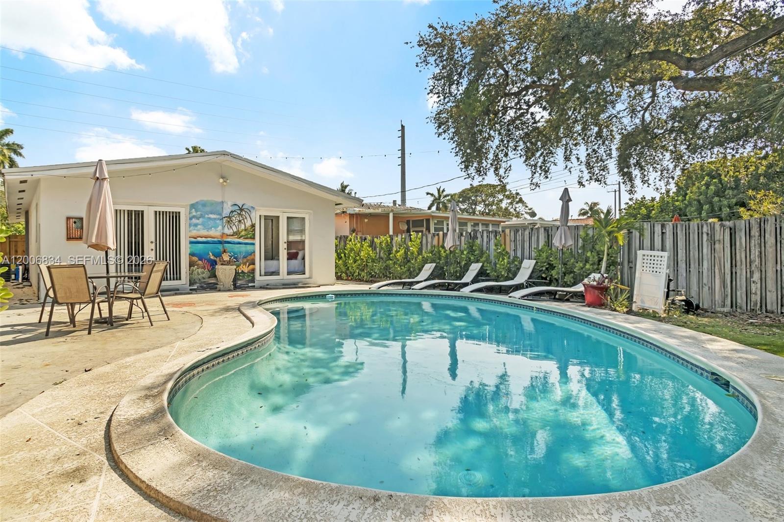 Welcome to your dream retreat! This beautifully renovated ranch-style home in Oakland Park offers the perfect blend of comfort, style, and convenience. Featuring 3 spacious bedrooms and 2 updated bathrooms, this home is ideal for both full-time living or a lucrative investment opportunity. Inside, you’ll find sleek tile flooring throughout, a modern kitchen with granite countertops, and a double oven—perfect for entertaining or everyday living. Two of the bedrooms overlook the sparkling pool, creating a relaxing, resort-style feel, while ceiling fans throughout add to your comfort. Step outside to your private backyard oasis, complete with a large fenced-in pool, expansive patio space, and a convenient storage shed. Recent upgrades include a new pool heater and a 2022 roof, giving you peace of mind. Located just 8 minutes from the beach and close to shopping, dining, and major highways, this home truly has it all. Whether you're looking for a primary residence, vacation home, or short-term rental investment, this property is a must-see.