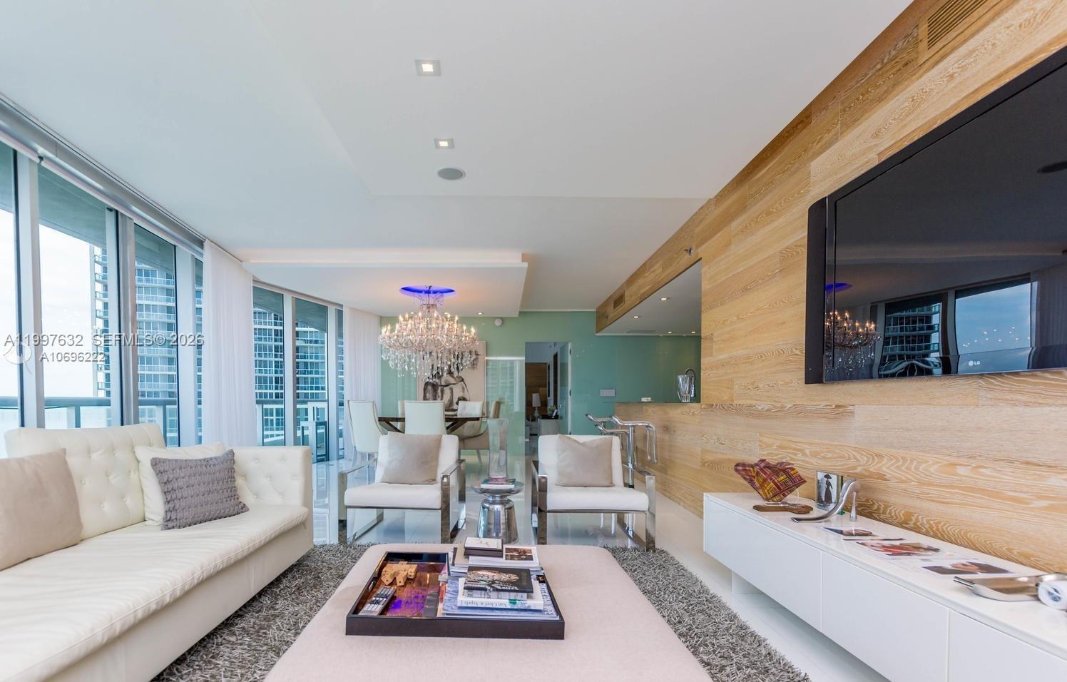 Beautiful bay front 3 bedroom, 2.5 bath condo in Icon Brickell. This one of a kind unit offers white porcelain floors throughout, wood & glass paneled walls, updated bathrooms, drop ceilings w/ spot lighting, walk-in closets, blackout roller shades in bedrooms, and much more. Chandeliers not included.