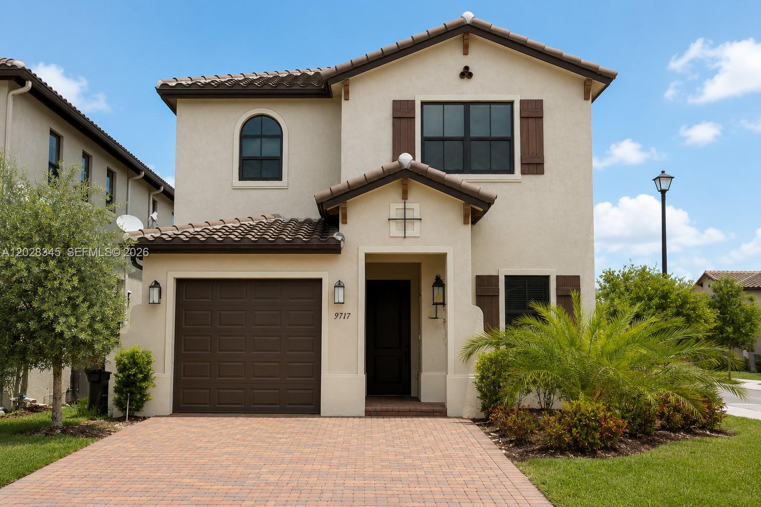 Welcome to Bonterra! This beautifully maintained corner-lot home offers 4 bedrooms and 3.5 bathrooms with a highly desirable floor plan featuring two primary suites, one on each level. The first floor includes a full ensuite bedroom, while the upstairs primary suite features dual vanities, a private toilet room, separate shower, and a large soaking tub.

Upstairs, the oversized second bedroom was expanded by enclosing the original loft area and now includes a dedicated sitting area, office space, and built-in library. Built-in closet systems are featured throughout the home.

Bright and spacious interiors showcase soaring ceilings, abundant natural light, tile flooring on the first floor, and light gray wood-look laminate flooring throughout the second level. The gourmet kitchen features granite countertops, stainless steel appliances, ample cabinetry, and a reverse osmosis drinking water system. Additional upgrades include a whole-house water treatment and water softener system.

Enjoy resort-style amenities including a clubhouse, fitness center, and swimming pool, all within a secure gated community. Conveniently located near major highways, Miami International Airport, shopping, dining. A fantastic opportunity in one of Northwest Miami-Dade’s most desirable communities.

Virtual Staging Disclosure: Some photographs have been virtually staged. Furniture and décor shown are for illustrative purposes only and are not included in the sale.