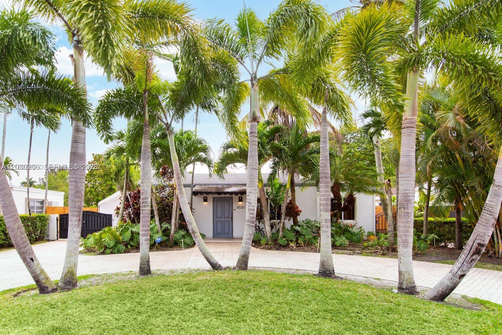 Updated 2-bedroom, 2-bath home located near The City of South Miami. Features include a remodeled kitchen with modern finishes, spacious living areas, and impact-resistant windows.
The oversized backyard offers a newly thatched tiki hut, BBQ area, and Sonos sound system serving both indoor and outdoor spaces. Additional features include a well-fed irrigation system and ample outdoor space for entertaining and recreation.
Conveniently located near shopping, dining, parks, schools, and major roadways. Buyers are encouraged to verify all property features, dimensions, and information independently.