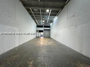 Spacious 1,100 SqFt warehouse for lease. This mixed-use unit is fully air-conditioned and features very high ceilings, ideal for a variety of business operations. The space includes a private restroom and large bay door for easy access. Conveniently situated in a prime commercial area near major highways, restaurants, and retail. Perfect for office, storage, or light industrial use.