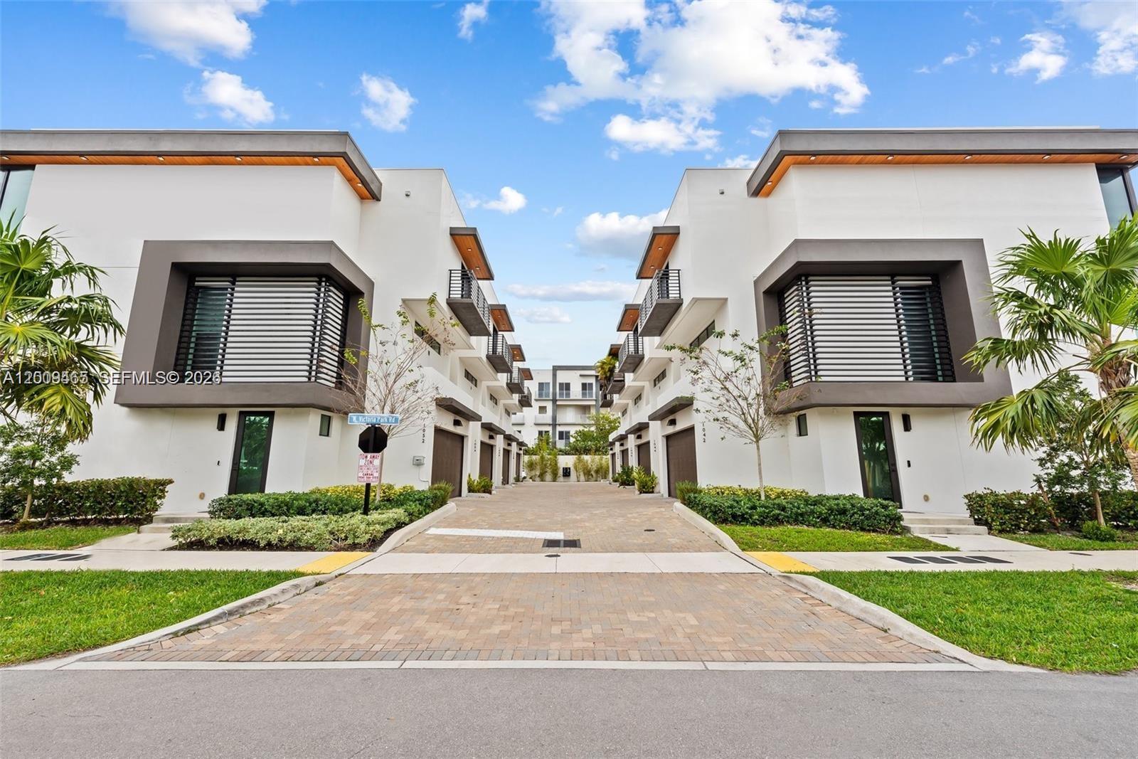 Welcome to a modern oasis of luxury! This beautiful townhome built in 2022 offers a private and contemporary living experience in a unique HOA of 8 units. The space consists of 3 bedrooms and 3.5 bathrooms, a 2-car garage equipped with a ready to use EV outlet, and guest parking. A stylish plunge pool with vivid market lights and high quality turf to complete the backyard. The home includes 10-foot ceilings, porcelain flooring, generous closets, and high quality blinds throughout. The spacious living room, stunning kitchen, and deck overlooking the pool are perfect for seamless and effortless hosting. This home is the epitome of STATE-OF-THE-ART LUXURY. CONVENIENTLY LOCATED NEAR WHOLE FOODS, GALLERIA MALL, FINE DINING, AND THE WHITE SANDY BEACHES
OF FT LAUDERDALE. EASY TO SHOW. FULLY FURNISHED PROPERTY AT NO EXTRA COST FROM SALE, WHILE STILL BEING THE MOST COMPETITIVE PRICE IN THE COMMUNITY. CURRENTLY RENTED FOR $7000/M UNTIL MAY 31st.