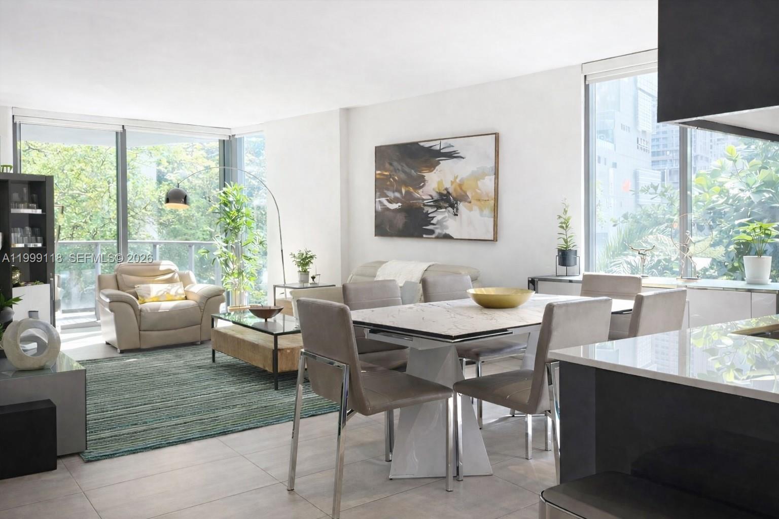 Beautifully remodeled 2BR+den residence at MyBrickell, with owner using the den as a 3rd bedroom, and 2 full baths. Located on the 3rd floor, this well-designed unit offers 1,116 SF, porcelain flooring throughout, impact windows and doors, in-unit washer/dryer, a spacious living and dining area, and a beautifully updated kitchen. 

Private balcony feels peaceful and relaxed, surrounded by trees and city views. Includes 1 assigned parking space. Building amenities include pool, gym, business center, front desk security, and guest parking. Airbnb allowed with 28-night minimum. 

Prime location in the heart of Miami’s Financial District, just 1 block from Brickell City Centre and 1 block from Metromover/Metrorail, with restaurants and everyday conveniences nearby. Furniture negotiable. 

Information is deemed reliable but not guaranteed and subject to errors, omissions, or changes without notice. Buyer and buyer’s agent should independently verify all information, including square footage, rental restrictions, HOA/building policies, room use, and any applicable permits or approvals.