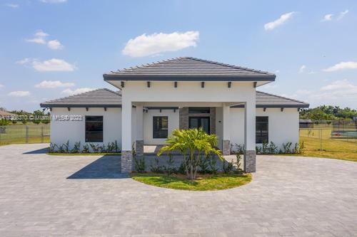 NEW CONSTRUCTION!  This is one of 8 newly constructed homes. This property is a 5 bedroom, 3.5 bath, 3 car garage with Porte Cochere and circular driveway on a 1 acre lot.  Home includes 17 x 32 pool and a 7 x 7 jacuzzi.  Impact windows and doors, floor to ceiling windows in family room, 10 ft ceilings & 8 foot wood doors. 24 x 24 porcelain tile floors throughout the home, quarts countertops in kitchen and bathrooms. This gem is located in the Redlands, in Miami-Dade. When you pull up to the property you will be greeted by a Porte Cochere and huge circular driveway. As you walk through the front door, you will notice an open floor format. An island kitchen of your dreams, spacious with white wood cabinetry, self closing drawers, covered terrace. Plenty of land for your family to enjoy!