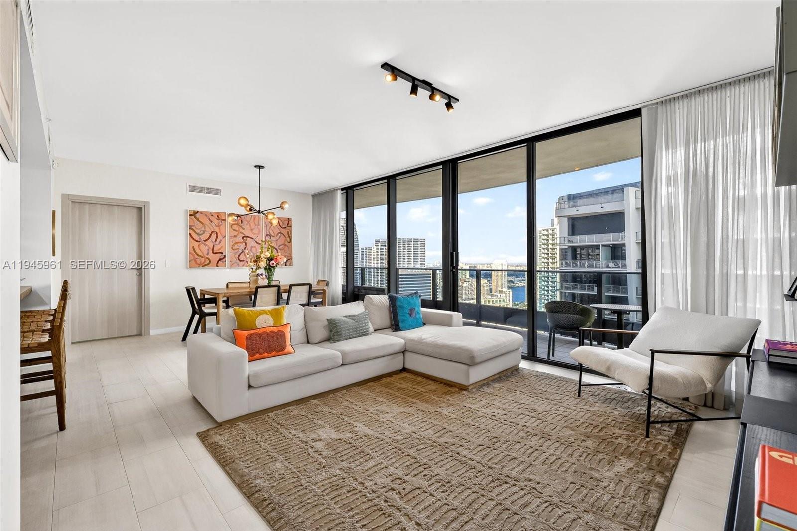 Located in the heart of Brickell, this contemporary and luxurious 2-bedroom, 2.5-bath residence offers refined city living at its best. Unit 4809 features an open-concept floor plan with 9-foot floor-to-ceiling windows, built-in closets, blackout blinds in both bedrooms, and Italian tile flooring throughout. The chef’s kitchen is appointed with a full suite of Miele appliances and Snaidero cabinetry, while the primary bathroom showcases elegant marble finishes and a walk-in rainfall shower. Thoughtful owner upgrades include custom wallpaper, light fixtures, a built-out pantry, and linear diffusers. Brickell Flatiron is widely regarded Brickell’s premier residential building, offering an exceptional amenity collection with two resort-style pool decks, a state-of-the-art fitness center, and a spa located on the 64th floor. Ideally situated within walking distance to Brickell’s most acclaimed dining, shopping, and entertainment destinations.