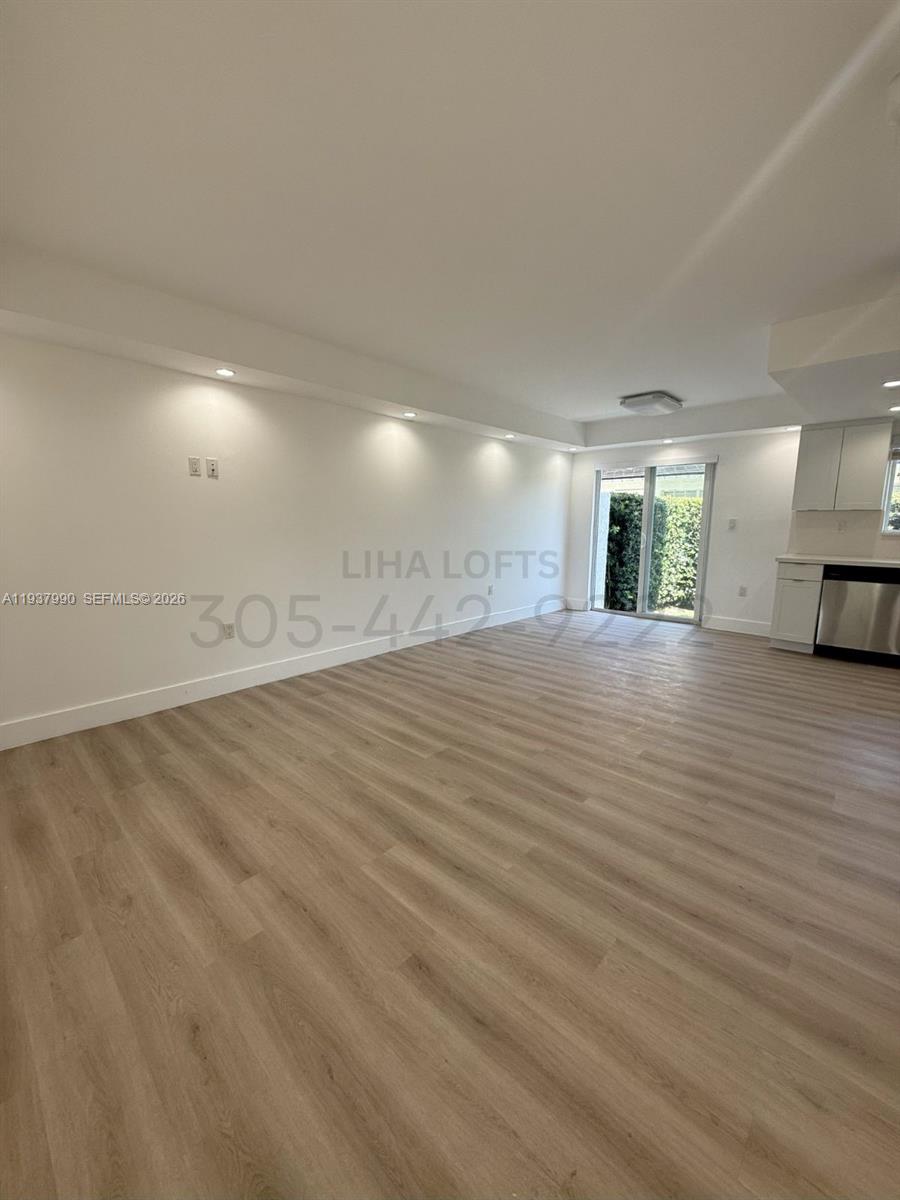 Beautiful 1000 sq. ft. 2 bedroom/2 bathroom townhouse with backyard and side terrace. Spacious and updated unit has a large living/dining area that connects to the modern kitchen. Kitchen has granite countertops and stainless steel appliances including dishwasher, microwave, electric stove/oven, and refrigerator. Primary bedroom has two walk-in closets and an en-suite bathroom. En-suite Bathroom has custom glass shower with white vanity. Private access to front terrace. Second bedroom has a closet and has its own access to front terrace. Second bathroom has tile shower and white vanity. Large backyard with outdoor patio. Central A/C. Impact Windows and Doors. Keyless Entry. 1 Assigned Parking Spot. Onsite Building Laundry Facilities. Pet Friendly.