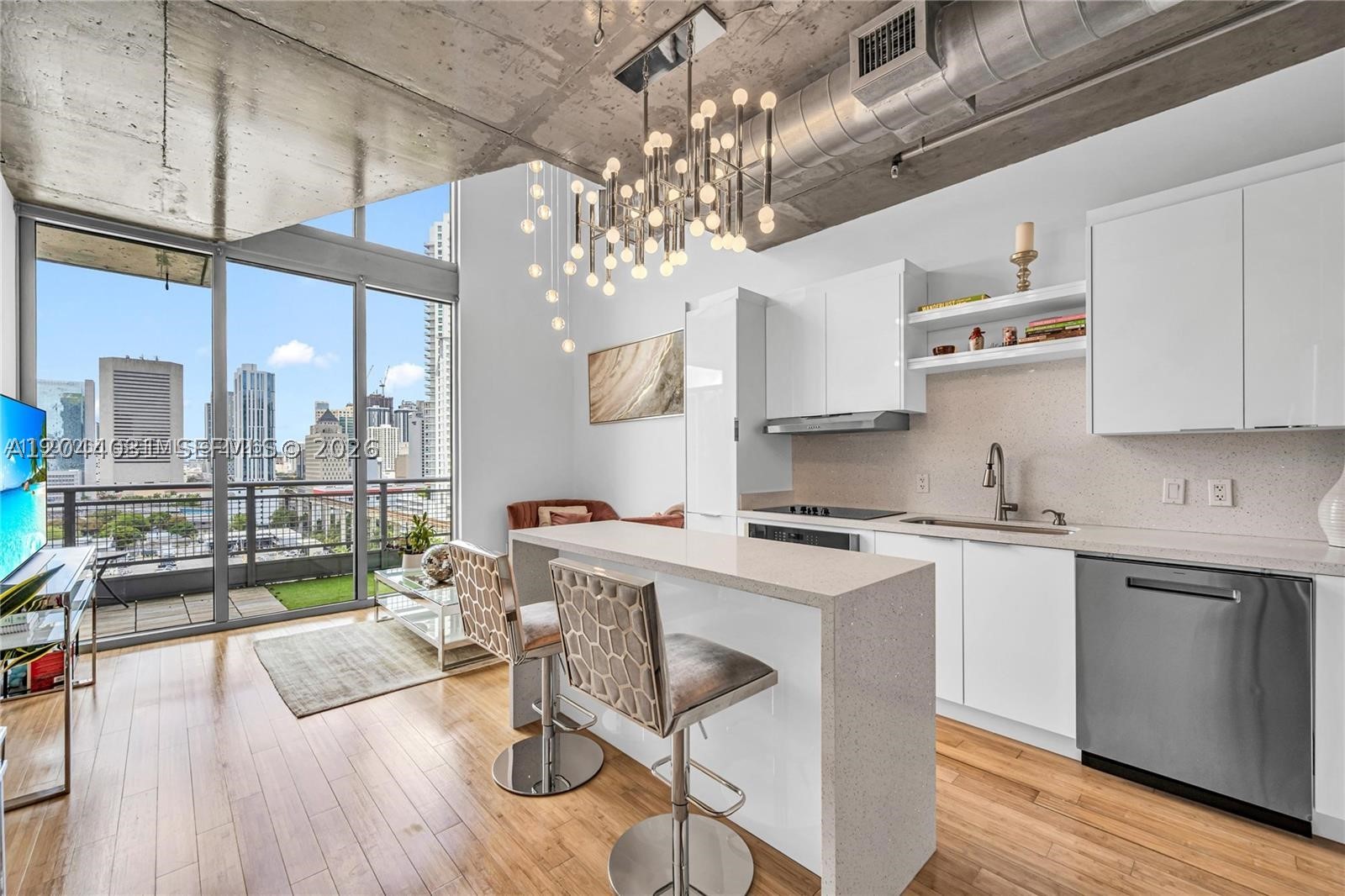 Rare opportunity to rent this spectacular 17th-floor residence at Neo Vertika with breathtaking, unobstructed Miami River and skyline views. This spacious loft-style 1-bedroom, 1.5-bath residence features soaring ceilings, abundant natural light, a beautifully redesigned open kitchen, and a private glass-enclosed primary suite upstairs. Enjoy resort-style amenities including a state-of-the-art fitness center, basketball and racquetball courts, cross-fit area, business center, children's playroom, dog park, and on-site dining at American Social. One assigned parking space (#5093) is included. Ideally located minutes from Brickell, Downtown, Wynwood, Midtown, Design District, Miami Beach, and Miami International Airport, with easy access to major highways. Experience luxury urban living in one of Miami's most vibrant waterfront communities. APARTMENT IS UNFURNISHED