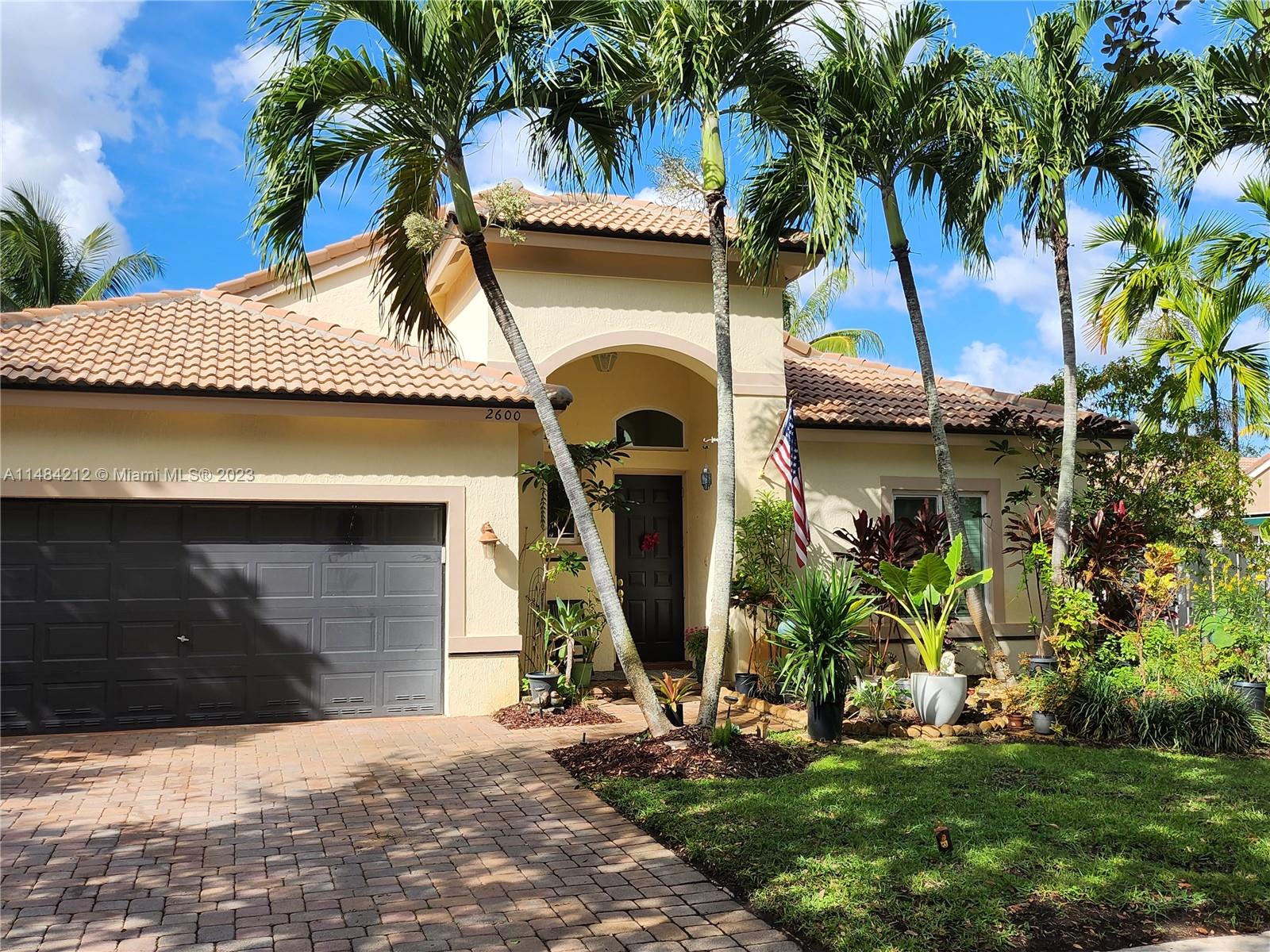 This lovely home offers great open living space w/ vaulted ceilings that provides light airy feel, nice natural light. Family room-kitchen with stainless steel appliances and cooking island. Grand primary suite w/ private bathroom, 2 car garage, half bathroom for guests, impact windows, *SOLAR PANELS* & more! Perfect backyard for gardening and enjoying the beautiful sunny south Florida weather! Located in a gated community that covers basic cable.   5 star Amenities w/ Resort style heated pool, full professional gym, children's playground, volleyball court, tennis courts, basketball court. Just minutes away from Sunset Lakes Elementary, shopping and restaurants.  Windows are impact, French doors & sliders are not and have shutters. Roof is original. Don't let this opportunity pass you by!