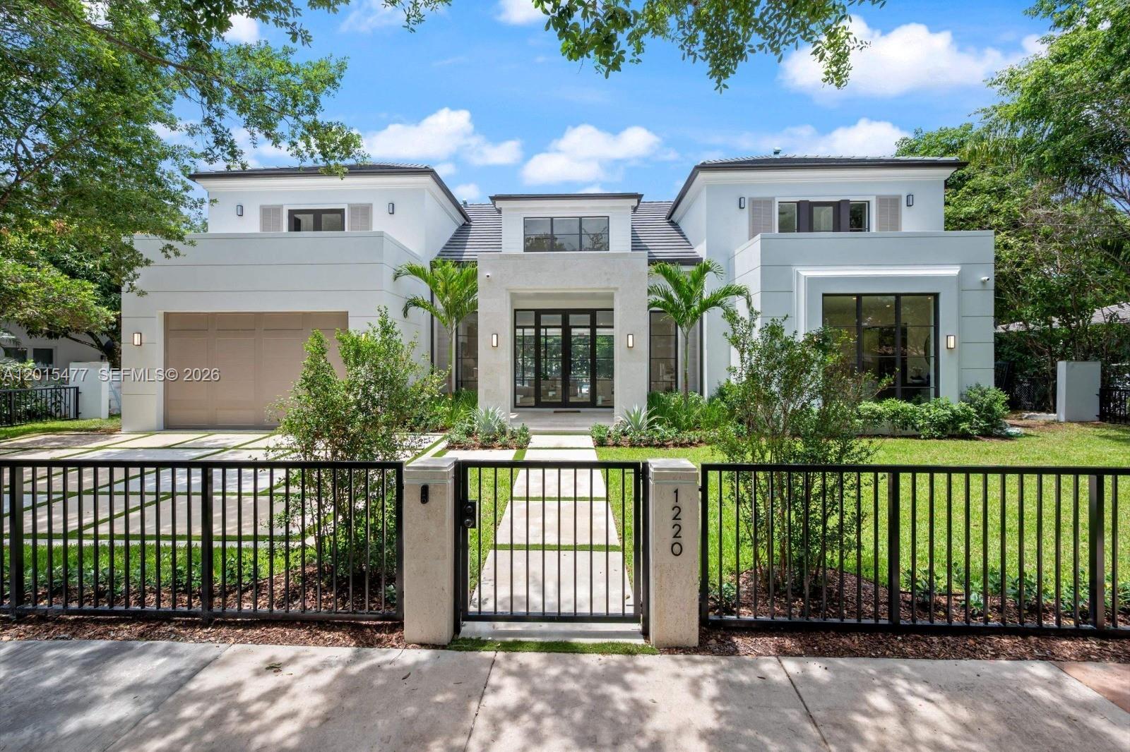 New construction masterpiece in South Gables! Situated on a 10,360 SF lot, this stunning 5BD/5.5BA residence offers 4,074 SF of AC living space (6,218 total SF) designed for seamless indoor-outdoor living. Floor-to-ceiling glass doors open to a private oasis featuring a pool, covered terrace, and summer kitchen. The thoughtfully designed layout includes walk-in closets in every bedroom, with a primary suite featuring dual closets and a soaking tub. This estate offers custom-level sophistication with a customized wine cellar, smart toilets in every bathroom, and a full fire alarm system. Premium finishes include white oak flooring, custom cabinetry, and Thermador appliances. Additional features: 2-car garage, gas appliances, and tankless water heaters. Ideally located near top-rated schools.