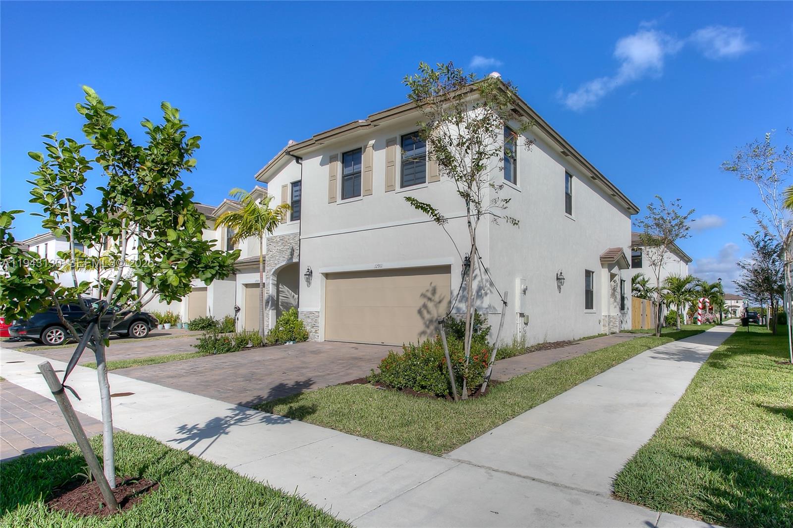 GOOD VIDEO AVAILABLE UPON REQUEST. BEST PRICED & Unique CORNER LOT  townhome with a 2 car garage. RESORT STYLE LIVING! Low $99 HOA fee & it's worth every penny with all the amenities included! Security, video surveillance throughout the community, clubhouse for events, Large pool/playgrounds & MORE!! Not a gated community so you won't deal with the delays for guests visiting you or when receiving deliveries. HOME is truly in immaculate conditions with plenty of upgrades to include quartz countertops/stainless steel appliances, backyard upgraded to concrete, zebra/blackout blinds & more! Plenty of parking spaces in addition to the 2 car garage. Make this great home yours today!