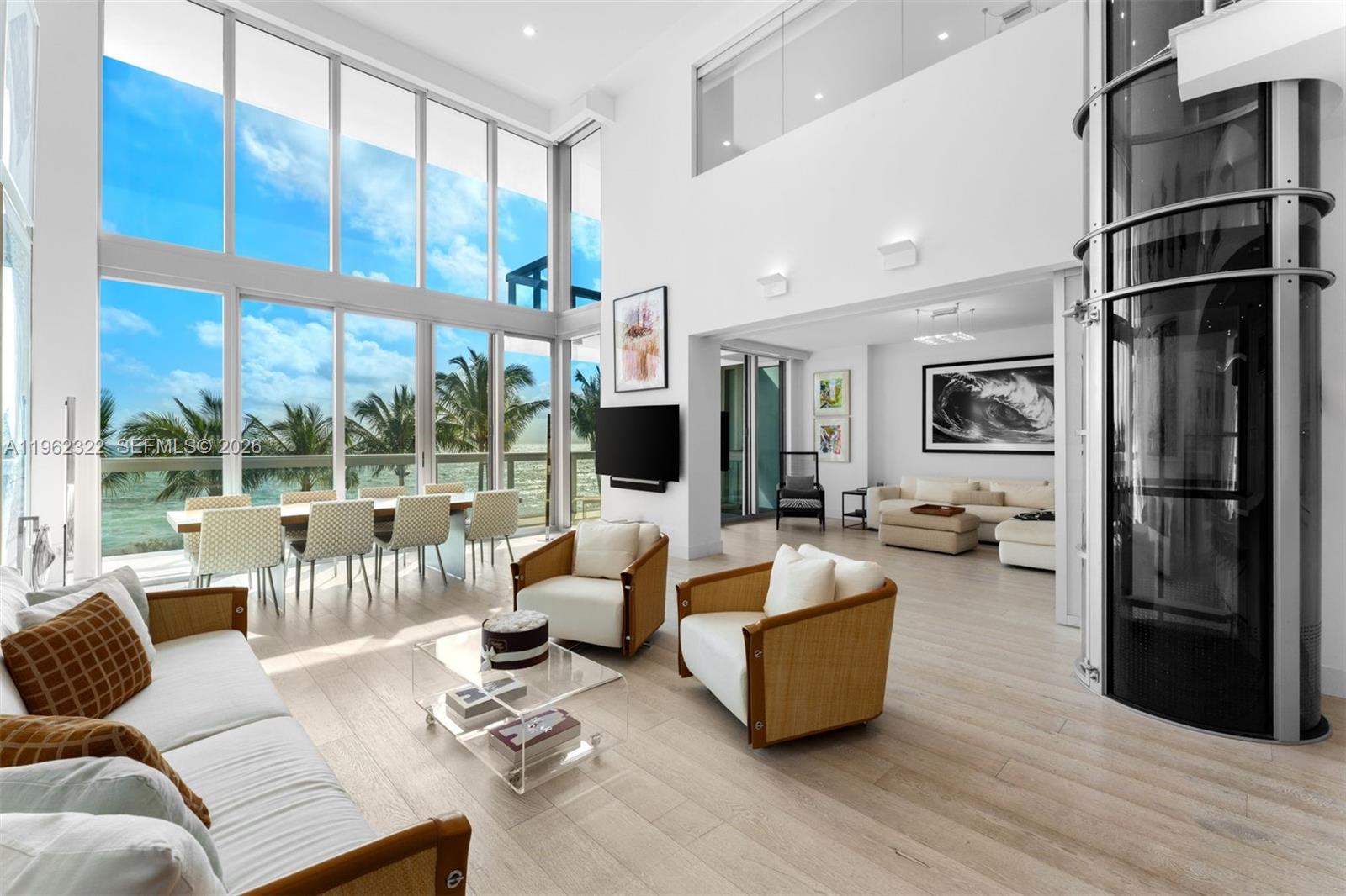The best value for a beachfront condo over 3,000 square feet in Miami Beach to Bal Harbour, Beach House 3 at the Carillon Wellness Resort is a premier piece of Miami Beach luxury real estate. This stunning oceanfront condo offers the privacy of a single-family home, with an open-concept floor plan, soaring 20-foot ceilings, and expansive windows. A grand staircase leads to an open-air office with mesmerizing views of the Atlantic Ocean. The grand suite spans the full length of the upper level and includes a private balcony and two walk-in closets, while a private internal elevator provides effortless movement between both floors.

This luxury residence features a flexible layout with two primary suites—one on the main level and the Grand Suite upstairs. The smart floor plan includes versatile multi-purpose rooms with innovative, collapsible walls that can expand the living space or partition into private retreats. Additional high-end features include a large laundry room, extensive oversized closets, and dedicated storage.

Owners enjoy unlimited access to the luxury amenities at the Carillon Miami Beach, including a globally renowned spa, cutting-edge fitness programming, four heated swimming pools, diverse gourmet dining venues, and a full-service private beach club. Positioned near Bal Harbour, this North Beach oceanfront condo is the perfect combination of a sophisticated home and a five-star wellness lifestyle.