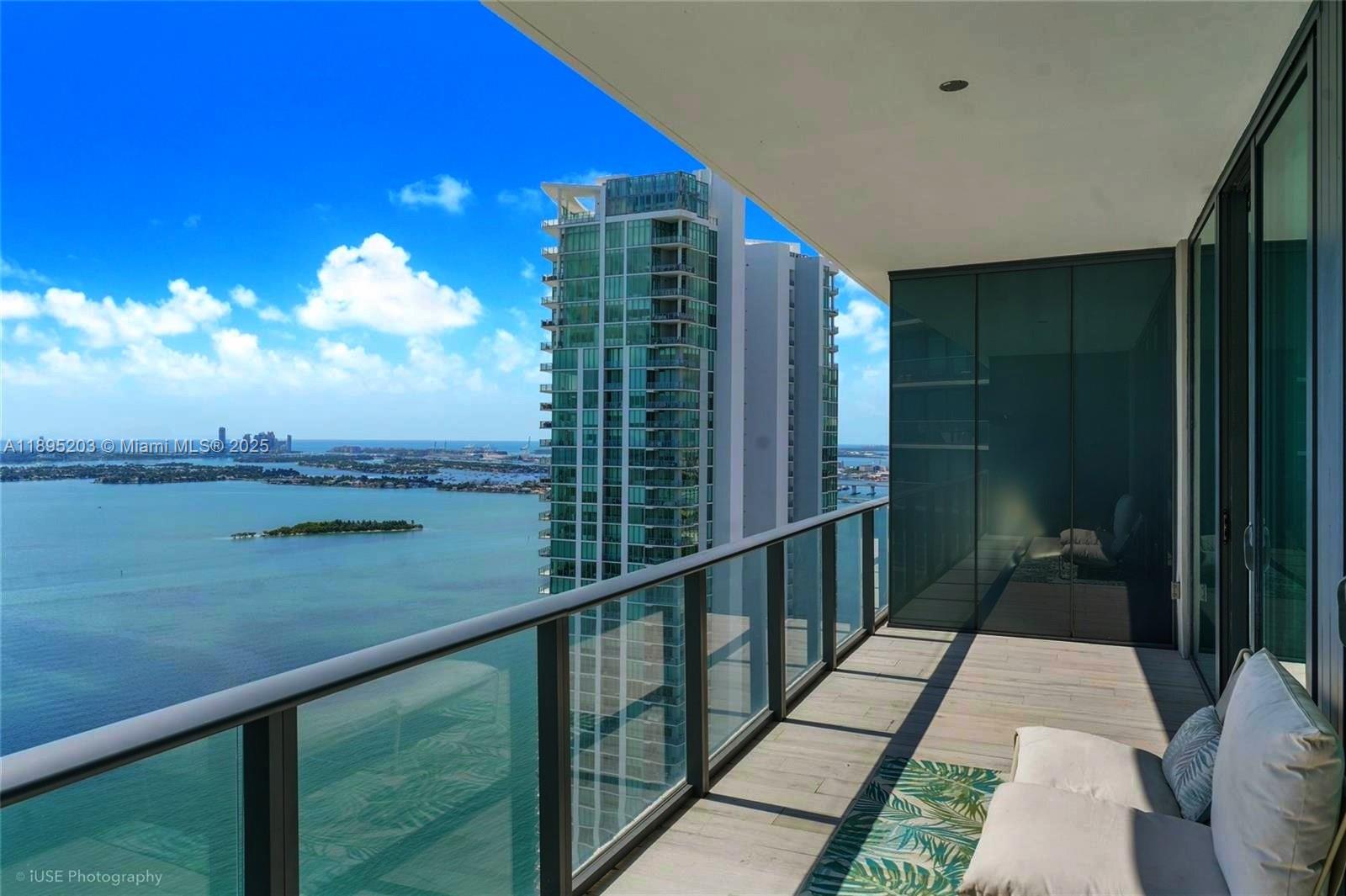 Step into refined luxury with this exquisite 2-bedroom + Den residence in the iconic Gran Paraiso. Perched on the 41st floor, Unit 4106 captures breathtaking panoramic views of Biscayne Bay, Miami Beach, and the Atlantic Ocean. Designed for the ultimate lifestyle experience, Gran Paraiso features five-star amenities including a resort-style pool, state-of-the-art gym, spa, tennis courts, yoga studio, private theater, bowling lanes, and more. With full concierge and security services, every detail is crafted for comfort and exclusivity.