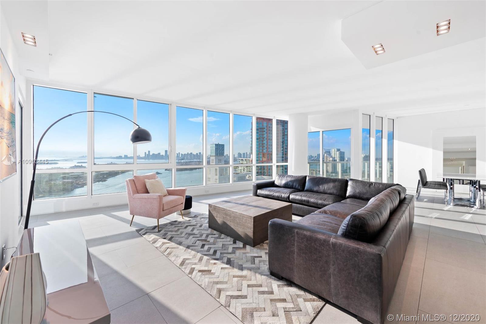 Reimagined and a true one-of-kind 3,300+ SF custom, combined SW corner residence is meticulously redesigned by blending wonderful exteriors and panoramic vistas with the finest interior appointments. Impressive 32' wide living room perched above the Atlantic, Biscayne Bay and South Pointe Park, offering a full panorama from the ocean to Miami's skyline sunsets. Brand new custom features include a dreamy master suite and spa and relaxation lounge with warm wood tones, natural stones + custom lighting, a white oak louver wall housing a fabulous bar, all new designed baths and new gourmet kitchen.  Crestron/Lutron/Sonos technology.  Discover the unparalleled lifestyle Continuum offers its residents on a 12.5 acre beachfront oasis at the southernmost tip of the island of Miami Beach.