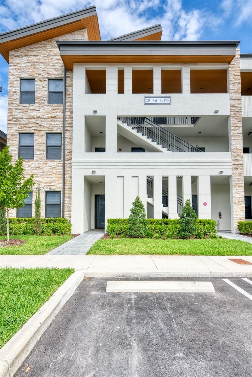 Modern luxury apartment in Apex Doral!!! Two master bedroom suites with walk in closets and two contemporary style bathrooms. Tile wood floors throughout the entire apartment. Impact windows and doors with blackout shades for ultimate privacy. Elegant kitchen with quartz countertops and large island for entertaining guest. Alexa voice controlled home automated system incorporated throughout the apartment. The apartment also features an open balcony with laid out artificial grass on the floor and overlooking natural reserve. Access to resort style clubhouse which includes fitness center, party room, billiards room, large pool with waterfall, Water Park for kids, kids playground, basketball court, tennis, soccer field. This is a MUST see!!!!