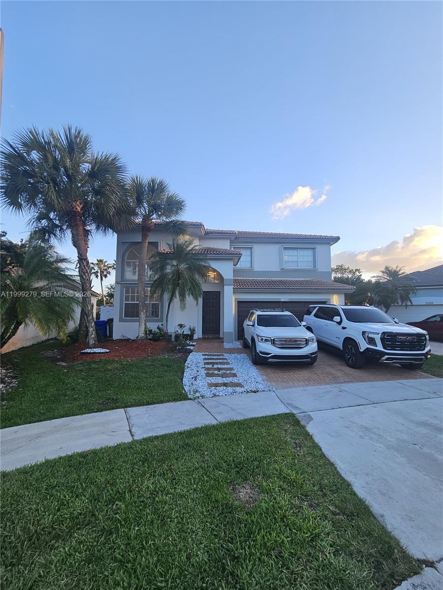 Beautifully renovated 4-bedroom, 3-bath home located in a desirable Pembroke Pines area. This property features new flooring throughout, a modern kitchen, and fully updated bathrooms. The layout includes one bedroom and a full bathroom on the first floor, ideal for guests or multi-generational living. Enjoy a fenced backyard, perfect for added privacy and outdoor enjoyment. The community offers excellent amenities including a clubhouse, swimming pool, gym, tennis courts, and basketball courts. Move-in ready and perfect for families seeking comfort, security, and lifestyle.
