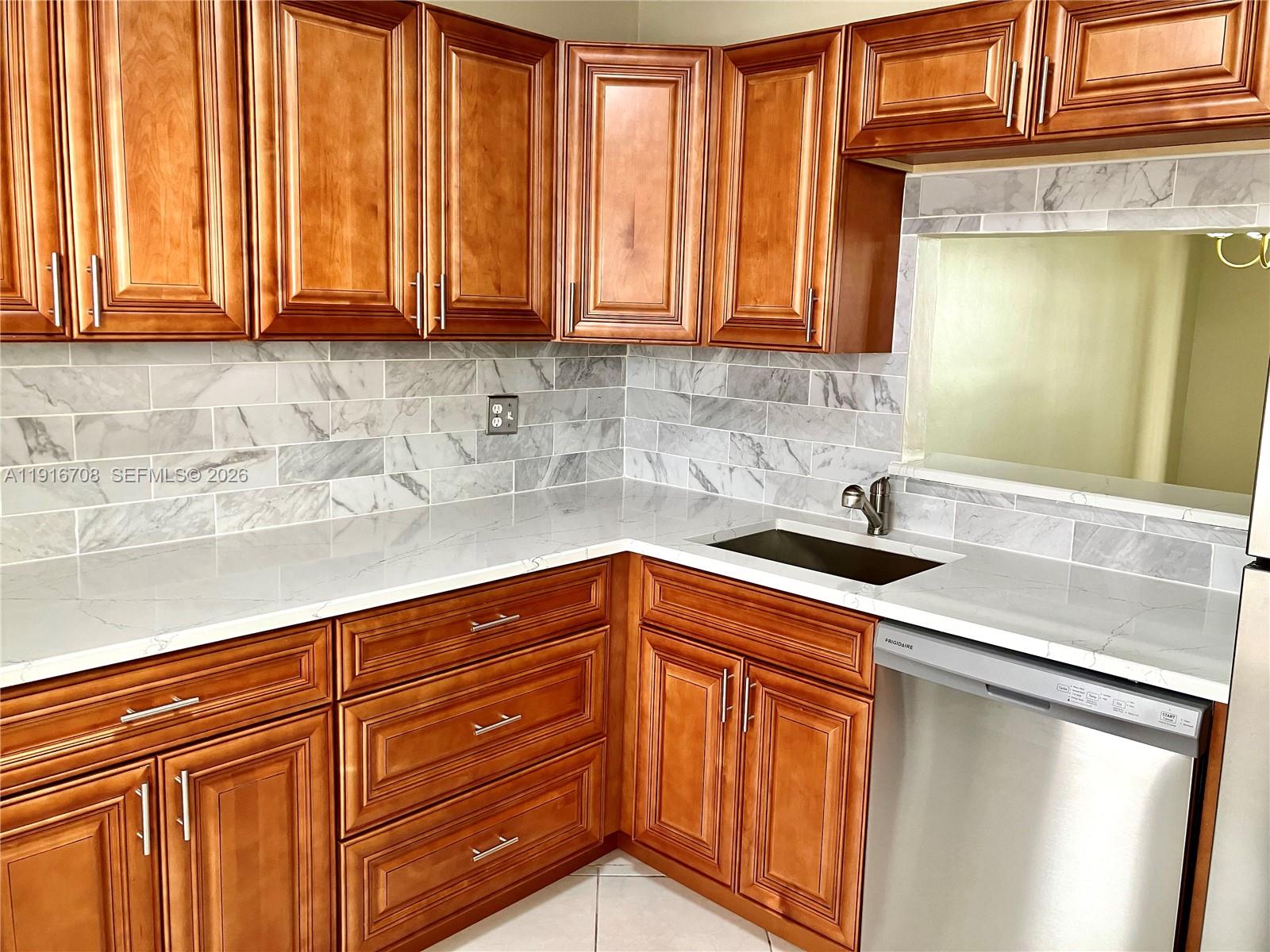 ARE YOU READY FOR A DEAL ON A FULLY RENOVATED CONDO?? Come and Get It!! Bring Your Offers! Incredible value, & totally renovated, ground floor, corner unit, 1/1.5 condo! 
If you are in search of a full time, snowbird, or Canadian paradise, for your winter retreat, the 55+ community of the Garnet Condo is the place to be! Incredible value in a complex which has completed its required inspections & studies. The entry opens to a brand new kitchen, a stunning half bath, and spacious living area. Everything has been redone! Tile floors & fresh paint throughout. ALL BRAND NEW cabinets, granite countertops, SS appliances, bath vanities, bath fixtures, ceiling fans, light fixtures, blinds, AC & water heater! This is the very definition of MOVE IN READY!! The large bedroom features a main bath & walk in closet.  A super Florida room & exterior patio complete the package. Additional clubhouse amenities are truly wonderful, with pool, sauna, tennis & pickle ball, & shuffleboard courts, exercise room, game room, billiards, bbq area, and more! Low Dues! THIS IS A MUST SEE! If you see it, you will buy it! Do not miss this one!