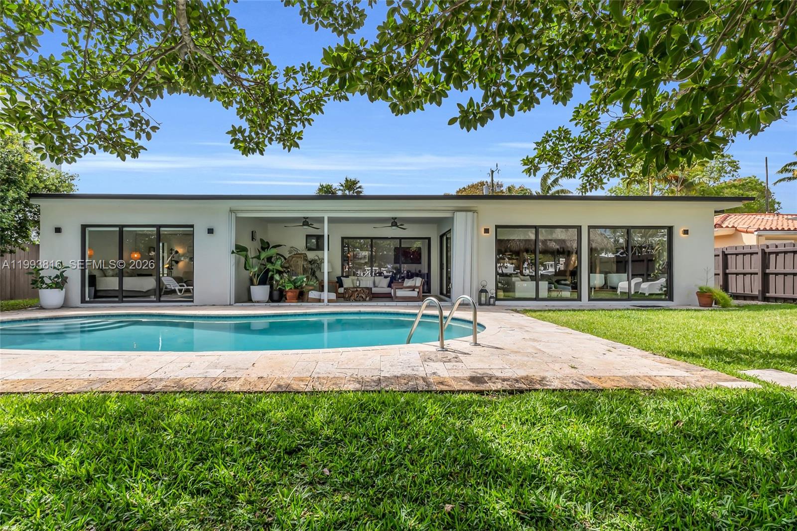 Experience the pinnacle of refined waterfront living in this exquisitely renovated 3-bedroom, 2-bath residence nestled in the prestigious and highly sought-after Keystone Point community. Thoughtfully reimagined with impeccable attention to detail, this exceptional home showcases a seamless blend of modern sophistication, timeless design, and elevated coastal luxury.
Designer-updated interiors set the tone throughout, with no expense spared in the home’s transformation. Recent upgrades include a brand-new roof, updated electrical, new plumbing, new air conditioner, brand-new driveway, and private two-car garage, offering both beauty and peace of mind. Inside, the residence unfolds into a bright and sophisticated open-concept floor plan adorned with premium finishes, custom details, and top-of-the-line appliances throughout.
At the center of the home, a stunning chef’s dream kitchen serves as both a functional showpiece and an entertainer’s delight, perfectly designed for intimate family living and stylish hosting alike. The home also features two generous walk-in closets and spa-inspired bathroom finishes, including a luxury Japanese-style smart toilet, creating an elevated everyday living experience with a touch of international sophistication.
Step outside into your own private tropical sanctuary, where a beautiful pool, brand-new tiki hut, and expansive backyard create the ultimate setting for effortless indoor-outdoor living. Designed for entertaining and relaxation, this resort-style outdoor space captures the very best of South Florida waterfront living.
A true boater’s paradise, this remarkable property offers 75 feet of dockage and direct ocean access with no fixed bridges, making it an exceptional opportunity for those who appreciate life on the water. Ideally positioned along one of Miami’s most coveted boating routes, just off the iconic Haulover Sandbar, this residence offers an unparalleled blend of luxury, exclusivity, and coastal elegance.
An extraordinary opportunity to acquire a fully renovated waterfront retreat in one of Miami’s most prestigious and coveted boating communities.