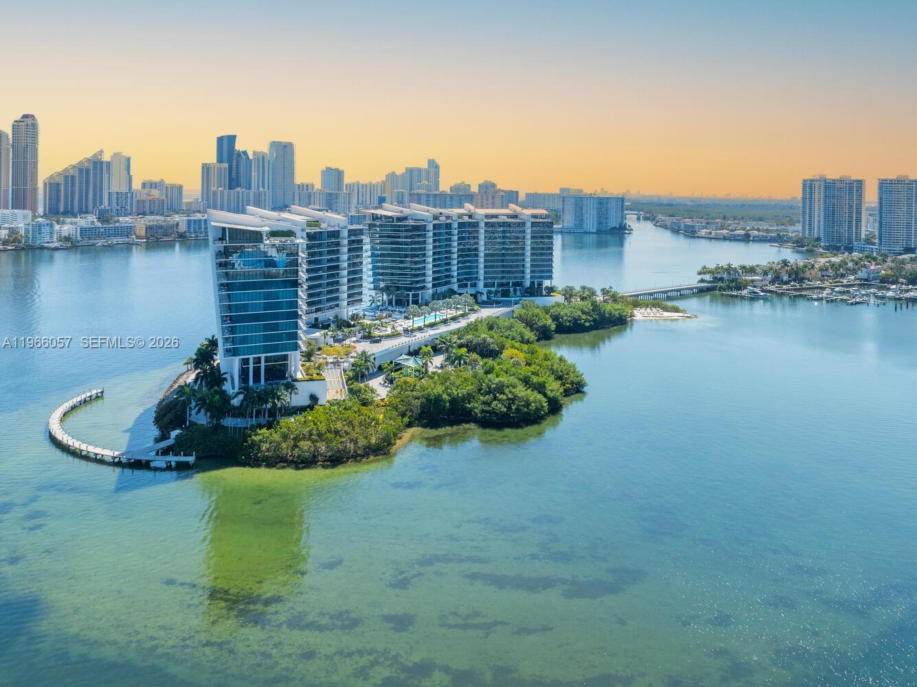 Crowning Aventura’s most exclusive private island enclave, THIS IS THE ONLY DESIGNER-READY PH AVAILABLE FOR SALE AT PRIVE at Island Estates; an exceptionally rare offering and the final opportunity to secure a customizable 2 story sky estate within this ultra-private waterfront sanctuary. Reserved for the most discerning buyer this residence presents a blank architectural canvas poised to become a bespoke legacy home in one of South Florida’s most secure and prestigious addresses.This extraordinary PH is delivered in designer-ready condition, allowing a visionary owner to curate every finish and detail to exact standards. A dramatic 15 foot ceilings in both levels creates a  remarkable volume and architectural drama throughout. Floor-to-ceiling glass frame unobstructed views of the Atlantic Ocean,Intracoastal Waterway and the city skyline, filling the interiors with natural light and breathtaking views from sunrise to sunset.The expansive wraparound terrace with over 3,200 SF transforms outdoor living into a private resort experience. A 24-foot private pool overlooks the water complemented by a summer kitchen designed for effortless al fresco dining and entertaining. The seamless indoor-outdoor flow offers an exceptional setting for hosting at scale while preserving absolute privacy.Designed for those who value privacy, security, and the ability to shape a legacy home from a blank canvas, this is one of the last remaining opportunities in Aventura—featuring refined renderings and bespoke interior concepts by acclaimed designer Fanny Haim & Associates.