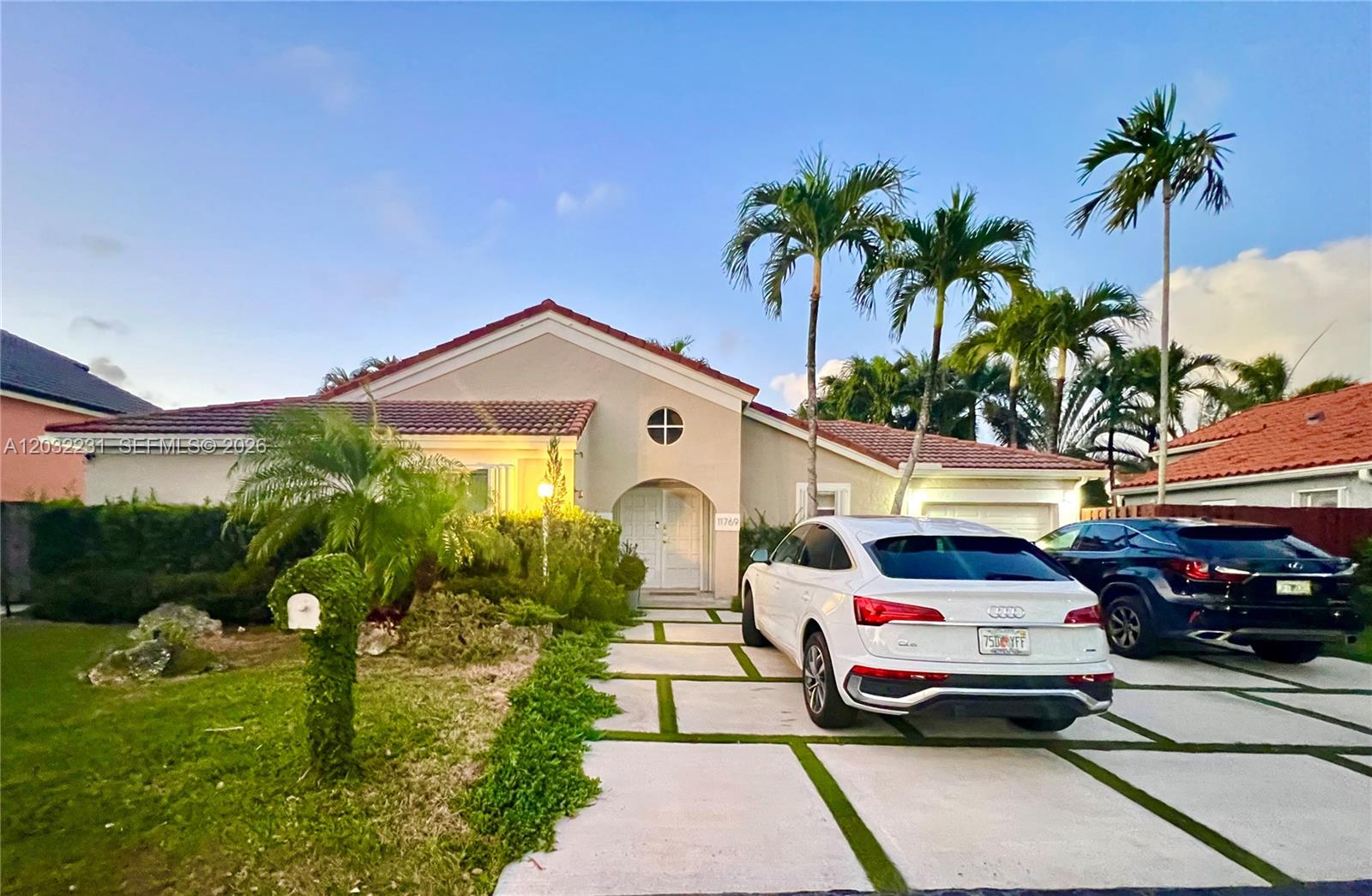Beautiful one-story home @ Las Casas, Gated community. Featuring two spacious bedrooms and 2.5 bathrooms, open floor plan /vaulted ceilings that create a bright and airy atmosphere. The remodeled kitchen includes stainless steel appliances and granite countertops, with a convenient snack counter that opens to a great room. Large great room that opens to a private paved backyard, ideal for entertainment or quiet enjoinment. The master bedroom comes with a walk-in closet for added storage. Accordion hurricane shutters throughout the house. Situated in a small, exclusive community of 44 homes, Great location for proximity to A+schools, shopping, etc.