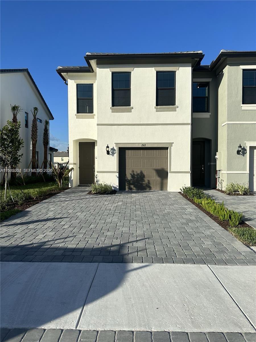 Beautiful lakefront corner townhouse built in 2023, offering 3 bedrooms,2.5 bathrooms and 1,754 SF under AC in the highly desirable gated community of OAK TREE.This bright and modern two-story residence combines luxury, comfort, and peaceful resort-style living in one of the most sought-after communities in the area.The home features spacious sun-filled living areas with elegant tile flooring throughout the main floor, contemporary finishes, and breathtaking lake and fountain views that create a truly serene atmosphere. The modern kitchen is designed with quartz countertops, stainless steel appliances, and an open-concept layout perfect for everyday living and entertaining.Upstairs offers 3 spacious bedrooms, including a beautiful primary suite with lake views, a large bathroom with separate shower, closed-door toilet area, and generous closet space. Separate laundry room with washer and dryer included.Enjoy your private backyard overlooking the lake and stunning South Florida sunsets. One-car garage plus additional driveway parking.OAK TREE offers exceptional resort-style amenities including clubhouse, pool, fitness center, 4 pickleball courts, BBQ areas, fire pits, hammocks, barefoot bar, dog park, outdoor seating areas, catering kitchen, and beautifully landscaped walking paths.This peaceful paradise is ideally located near shopping plazas, only 15 minutes from Downtown Fort Lauderdale and just 5 minutes from I-95.Place in paradise is now available for rent.