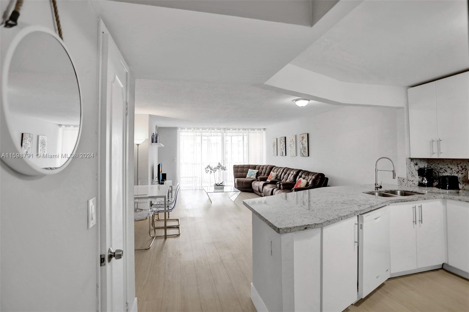 WOW! LIGHT & WHITE REMODELED LARGE 2 BED 2 BATH GEM. OPEN MODERN WHITE KITCHEN WITH GRANITE COUNTERS, EXTENDED BREAKFAST BAR, AND PANTRY. NEW PLUMBING & ELECTRIC. MODERN NEW BATHS WITH FLOATING VANITIES & HIDDEN PLUMBING, RAIN SHOWERS, DOUBLE SINKS IN MASTER BATH. MASTER BATH: SHOWER. GUEST: BATHTUB/SHOWER. GLASS MOSAIC. CLOSETS AND AMPLE CLOSET SPACE. SPACIOUS SCREENED BALCONY. VERY QUIET, SAFE 24/7 GUARD GATED COMMUNITY. SEVERAL POOLS. ASSIGNED PARKING, 2ND IN GUEST SPACE. GREEN AREAS & LAKES.