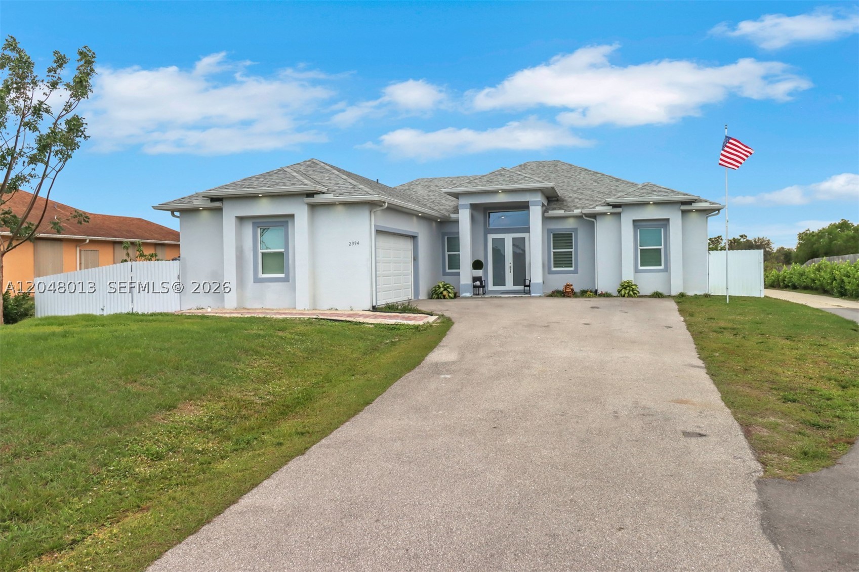 Stunning modern home sitting on acres of land in Naples. Elegant marble tile all throughout the house, as well as a gorgeous updated kitchen. 69260 leaves more than enough room for a pool. Combination Lock on the door, please call to make showing appointments.