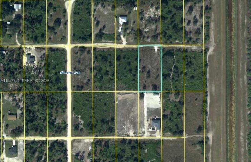 Tucked away in the serene countryside of LaBelle, this expansive 1.25-acre lot offers a rare opportunity to bring your vision to life in a peaceful, private setting. Unlike many vacant parcels in the area, the property is already cleared and development-ready, saving valuable time and effort, with a well already installed to give you a major head start. Thoughtful improvements include a culvert in place, ditches dug for proper drainage, and underground piping laid for electricity, adding significant value and convenience. Located on a quiet private street, the lot provides sought-after seclusion while remaining just a short drive from Fort Myers and Lehigh Acres for easy access to shopping, dining, and essential services. Surrounded by mature trees and natural beauty, this property perfectly balances tranquil country living with accessibility, making it ideal for a dream home, private retreat, or investment opportunity ready for your vision.