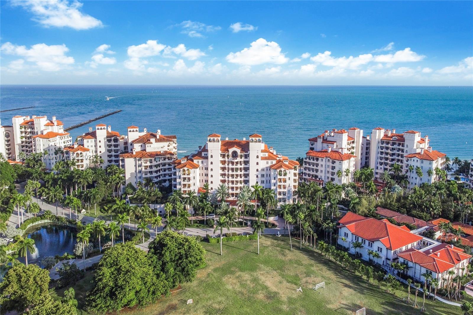 Welcome to fantastic Fisher Island! Walk downstairs  to the sandy beach and pool and hear the ocean waves from your terrace.  Elegant 3/3 and 1/2 with 2 large terraces facing East and West. Marble floors throughout. Spacious open living and dining area, open kitchen, oceanfront main bedroom with large closets. Additional bedrooms with golf course views.  Laundry room. 2 assigned covered parking spaces in addition to 1 golf cart space and storage unit.