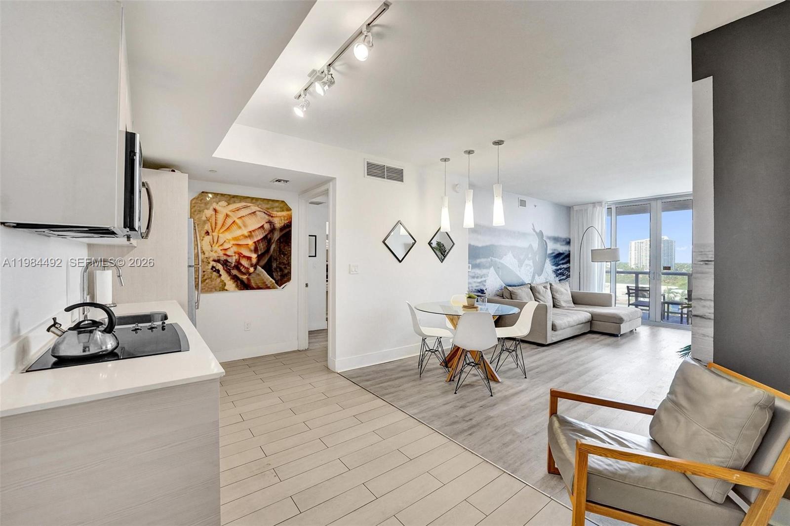BEAUTIFULLY FURNISHED DOUBLE 2BED/2BATH AT THE BEACHWALK RESORT WITH VERY NICE VIEW AND LARGE BALCONY. PROPERTY IS COMPOSED OF 2 UNITS IN 1 AS 906A & 906B. A: ONE BEDROOM SUITE CONTAINING A LARGE KITCHEN WITH SS APPLIANCES, WASHER AND DRYER, WOOD CABINETS & DINING TABLE. LARGE OPEN LIVING SPACE WITH COUCH & TV. LARGE KING BEDROOM SUITE WITH WALK-IN CLOSET & UPDATED BATH. BALCONY ACCESS FROM BOTH LIVING & BEDROOM AND TILE FLOOR. B: HAS TWO DOUBLE BEDS, WALK-IN CLOSET AND DESK AREA WITH SMALL REFRIGERATOR AND MICROWAVE, PLUS BALCONY & UPDATED BATH WITH FRAMELESS SHOWER ENCLOSURE. ROOFTOP & WATERFRONT POOL, GYM, BEACH ACCESS & SERVICE. INCOME FROM THE FIRST DAY, NO RESTRICTIONS,  HOA INCLUDES POWER, WIFI, CABLE, WATER & BUILDING INSURANCE. PORCELAIN TILE THROUGHOUT UNIT.