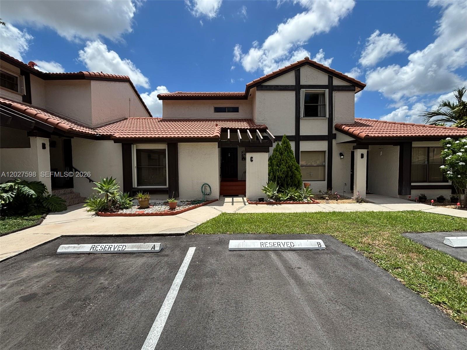 Spacious two-story residence in Lakes of the Meadow / Village Homes offering one of the larger floor plans in the community with approx. 1,560 sq. ft. of living area. The home features 3 bedrooms, 2.5 baths, a functional layout, interior laundry, updated kitchen cabinetry, updated countertops, stainless steel appliances, tile flooring on the first floor, and laminate/tile flooring upstairs. The primary suite includes an updated vanity area, walk-in closet space, and access to a private balcony with a relaxing community/lake-area feel. Additional highlights include accordion hurricane shutters, newer Rheem A/C components, fenced patio/deck space, and convenient parking near the unit. Enjoy an established West Kendall community with clubhouse, pool, fitness center, tennis courts, playgrounds, walking paths, security patrol, and mature landscaping. Conveniently located near supermarkets, restaurants, shopping, schools, medical offices, and major roads.