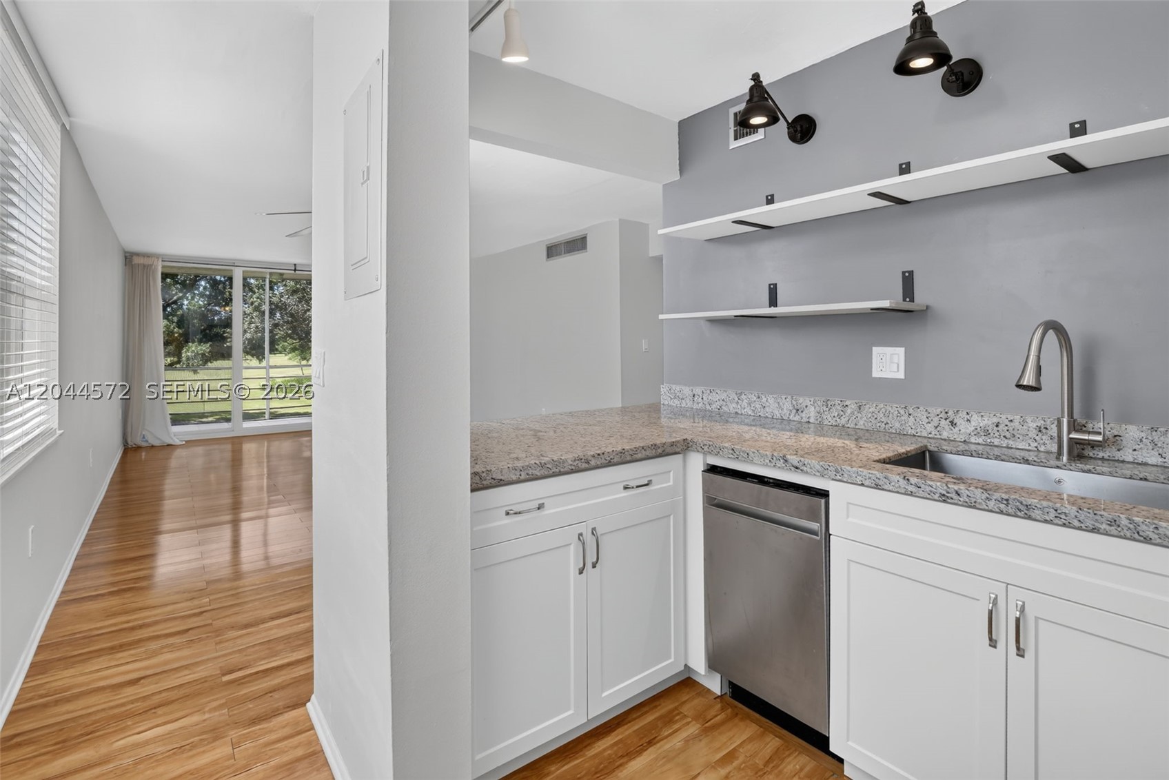 Rarely available corner unit in prestigious Pine Island Ridge boasting panoramic golf course views and abundant natural light! Enjoy total peace of mind with over $47k in capital improvements: brand-new impact windows, new electrical panel, new A/C, and new water heater. Features beautiful laminate flooring, fresh paint, and new carpet in the bedrooms. Complete with granite counters in the kitchen and partially renovated bathrooms with updated vanities. Enjoy private country club amenities and an unbeatable Davie location near Costco, NSU, and colleges. Zoned for Davie schools. HOA capital assessment is handled, making this bright oasis completely turn-key!