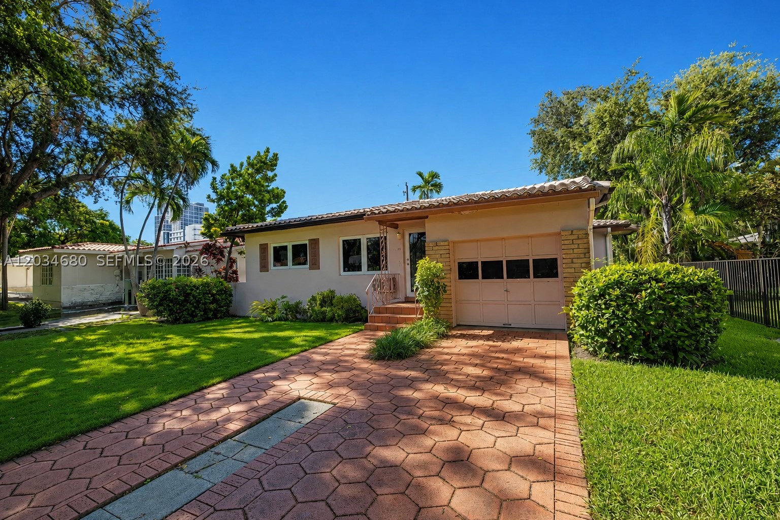 Nestled in the heart of Coral Gables, this inviting 3-bedroom, 2-bath residence offers the perfect blend of character, comfort, and location. Situated on a 6,000 SF lot, the home features approximately 1,831 SF of living space, original hardwood floors, abundant natural light, and a practical single-story layout. The spacious backyard provides plenty of room for entertaining, gardening, or future enhancements. A one-car garage and mature landscaping complete the property. Conveniently located just minutes from Miracle Mile, Merrick Park, Coconut Grove, the University of Miami, Brickell, Downtown Miami, and Miami International Airport. A wonderful opportunity to enjoy one of South Florida's most sought-after neighborhoods.