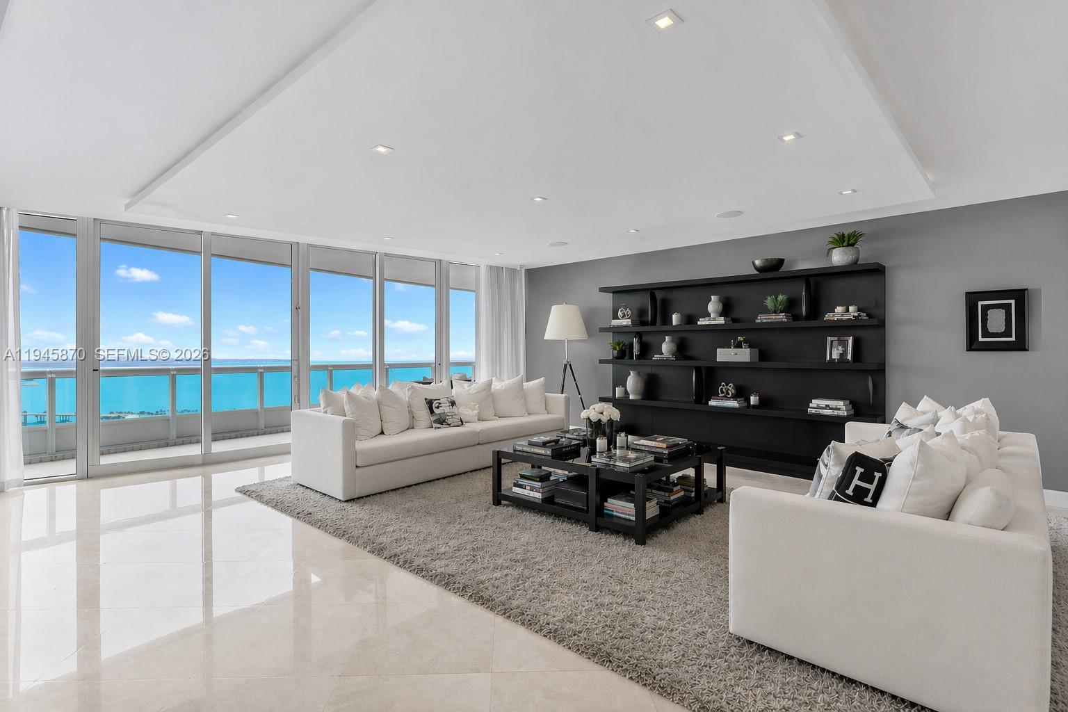 Experience refined waterfront living at Santa Maria, one of Brickell’s most prestigious buildings. This fully renovated 4,030 sq ft residence with over 1,000 sq ft of balcony space offers a 4-bedroom, 5.5-bath flow-through layout, private foyer, and elevator entry with stunning, unobstructed views of the ocean, bay, and Miami skyline. Expansive north- and west-facing terraces fill the home with natural light. Features include a Veneta kitchen with premium appliances, elegant wood and marble flooring, his-and-hers closets, and a spa bath overlooking the bay. Enjoy resort-style amenities—24-hour security, fitness center, pool, tennis, racquetball, marina access, and a prime Brickell lifestyle