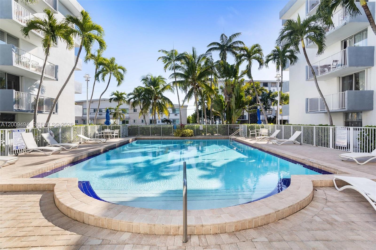 Price improvent for cash buyer only. Corner unit with renovated 2-bedroom, 2-bath residence on the 2nd floor of North Bay Village's sought-after waterfront enclave is move-in ready. The fully updated kitchen features quartz countertops, stainless steel appliances, and a designer tile backsplash.  Resort-style amenities include a waterfront heated pool, fitness center, 24/7 security patrol, and lush tropical gardens. One attached garage parking space included.