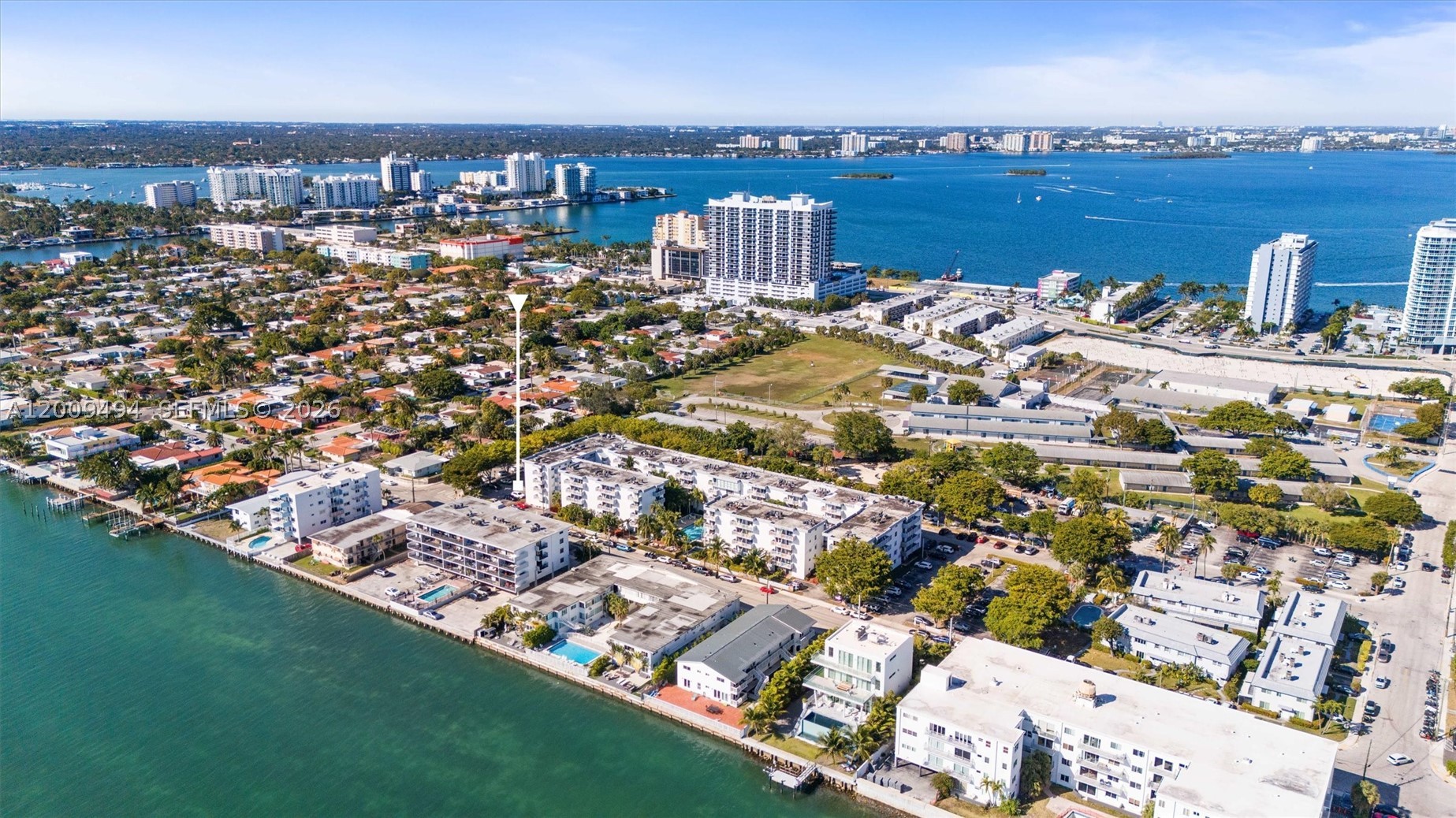 Price improvent for cash buyer only. Corner unit with renovated 2-bedroom, 2-bath residence on the 2nd floor of North Bay Village's sought-after waterfront enclave is move-in ready. The fully updated kitchen features quartz countertops, stainless steel appliances, and a designer tile backsplash.  Resort-style amenities include a waterfront heated pool, fitness center, 24/7 security patrol, and lush tropical gardens. One attached garage parking space included.