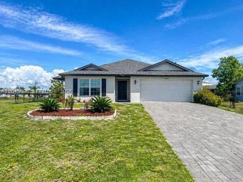 Welcome to this stunning newer construction home built in 2021, offering the perfect combination of modern design, energy efficiency, and functional living. This beautifully maintained residence showcases a bright, open-concept layout filled with natural light, creating a clean and airy feel throughout.    Step inside to find sleek tile flooring, neutral tones, and a seamless flow between the living, dining, and kitchen spaces — ideal for entertaining or everyday comfort. The modern kitchen and living areas are designed for today’s lifestyle, blending style and functionality effortlessly.    Enjoy the added value of solar panels, helping reduce energy costs while increasing efficiency — a major advantage for homeowners in Florida.    Step outside to your huge fully fenced backyard, offering endless possibilities — perfect for pets, gatherings, outdoor living, or even adding a future pool.    Key Features:  No HOA  Built in 2021 – newer construction, low maintenance  Bright, open, and airy floor plan  Modern finishes throughout  Energy-efficient solar panel system  Expansive fenced-in backyard  Move-in ready condition    Located in a growing Cape Coral area where similar homes are in strong demand, this property offers incredible value and opportunity. Aggressively priced – don’t miss your chance to own this modern home!  Schedule your private showing today!