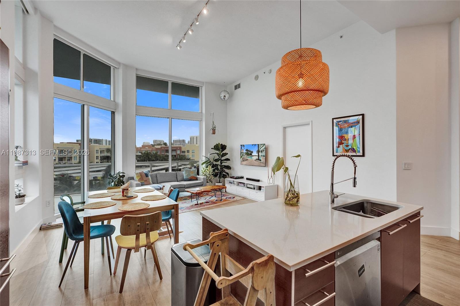 PRICE SIGNIFICANTLY REDUCED!  Owner motivated!

Welcome to Casa Good Vibes.

Experience the ultimate Miami lifestyle in this bright and rarely available loft-style condo, perfectly situated across from Margaret Pace Park. 
Boasting 13-foot ceilings and an open-concept layout, this stunning 2-bedroom, 2.5-bathroom residence includes a wrap-around balcony, laundry room and stylishly renovated floors, bathrooms, and lighting throughout.


The kitchen comes with updated appliances, a spacious island, and ample storage. Both bedrooms have ensuite bathrooms and walk-in closets.
The apartment also has a new AC unit and blackout shades in both bedrooms!
 For ultimate convenience, enjoy direct entry to your unit from your parking space, bypassing the elevator entirely.

Amenities include two pools, a state-of-the-art gym, an indoor kids' playroom, a social room, valet service, and 24-hour security. Get ready for luxury Miami living in the heart of the city.
Amazing opportunity at new price!