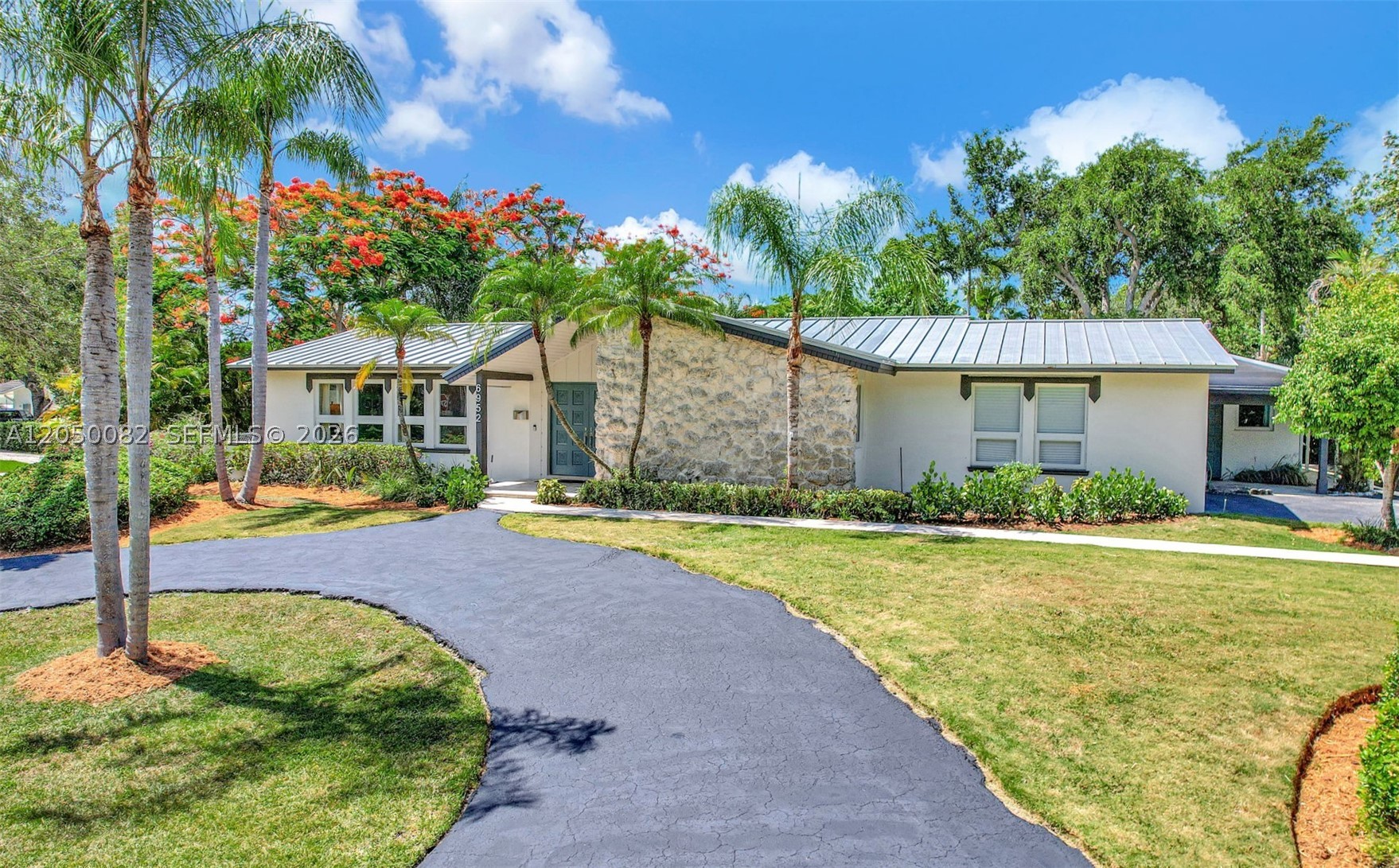 Nestled on a sprawling 18,000+ SF corner lot in the highly sought-after corridor east of Old Cutler, this exceptional North Palmetto Bay residence offers privacy, functionality, and an ideal layout for multigenerational living. The spacious home features 4 bedrooms, 3 bathrooms, and a two-car garage, while the separate guest quarters includes a bedroom, den, bathroom, and kitchenette—perfect for in-laws, guests, or a private office.  Thoughtfully updated with impact windows, a metal roof, a recently renovated kitchen, and a new Trane A/C system with a medical-grade UV air purification filter in the main house. Step outside to your own tropical backyard oasis featuring a heated saltwater pool surrounded by lush palms.  Offering added peace of mind, the property is located in Flood Zone X and is equipped with solar panels paired with Tesla backup battery storage, allowing the home to operate independently during power outages while keeping the average electric bill under $50 per month.  Ideally located within walking distance of top private schools—just one block from Westminster Christian School and minutes from Alexander Montessori—as well as The Falls, parks, dining, shopping, and everyday conveniences, this is a rare opportunity to own a beautifully updated home in one of Palmetto Bay's most desirable neighborhoods.