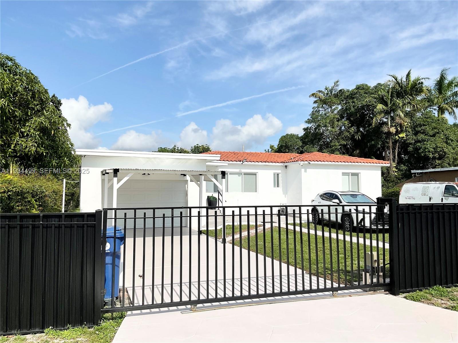 Awesome fully renovated Resort Style home, located in a desirable residential community in Biscayne Gardens (Miami-Dade).  Features include dark brown wood floors and magnificent marble tiles in the bathrooms, beautiful kitchen, top of the line stainless steel appliances with Quartz countertops.  This 3-bedroom, 2 full-bathroom house features new elegant design and newly resurfaced pool deck with gazebo, including 2 outdoor gas kitchens and sink for great barbecues. New modern indoor barn doors, white wood and matte black details. Tile roof in good condition (23 years old with permits), new air conditioning unit, impact windows and doors, new garage door, cleared and certified septic tank, washer and dryer and security cameras.  Close to Miami Beach, Miami International Airport, Broward, shopping centers, restaurants, supermarkets, schools, and major roads and highways (I-95 and FL Turnpike).  With a large 10,725 Sqf lot, this beautiful house is great for family and friends’ enjoyment and entertainment.